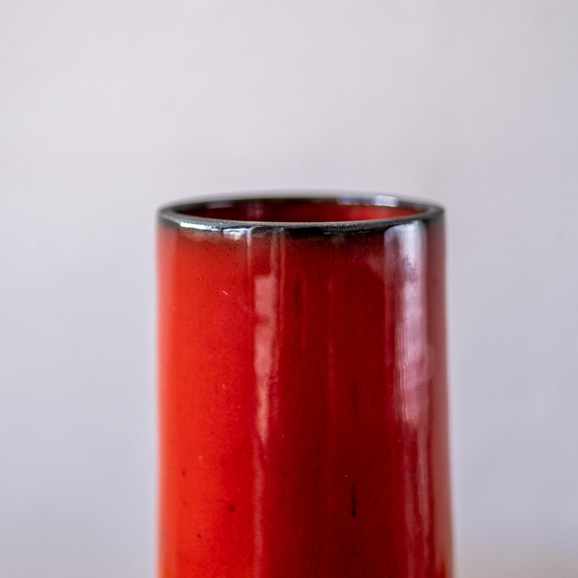 red cylinder vase