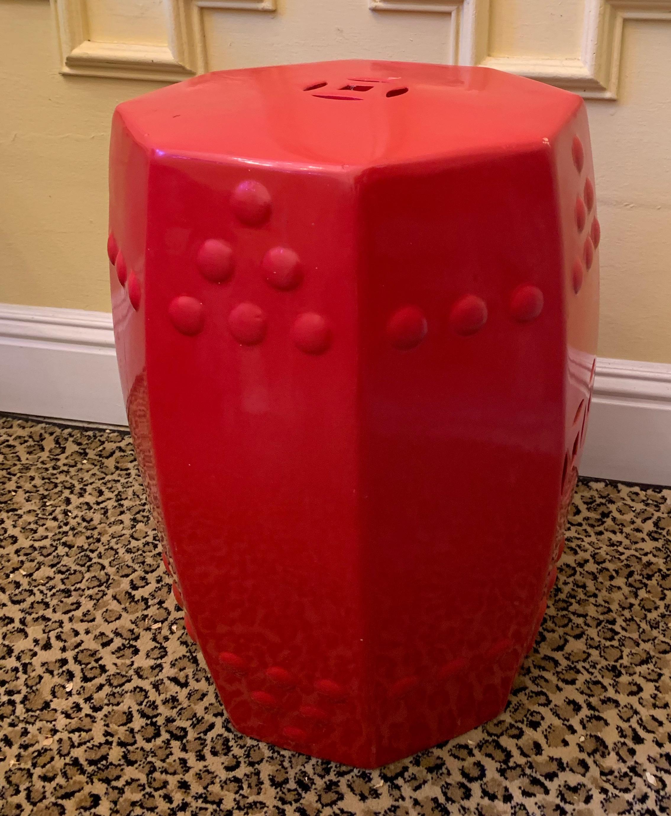 Red ceramic garden stool side table - red, the color of good luck, peace and joy is a wonderful contrast to the bold vibrant and green colors of the garden, and also becomes a practical focal point in the home - welcoming. A great piece for adding