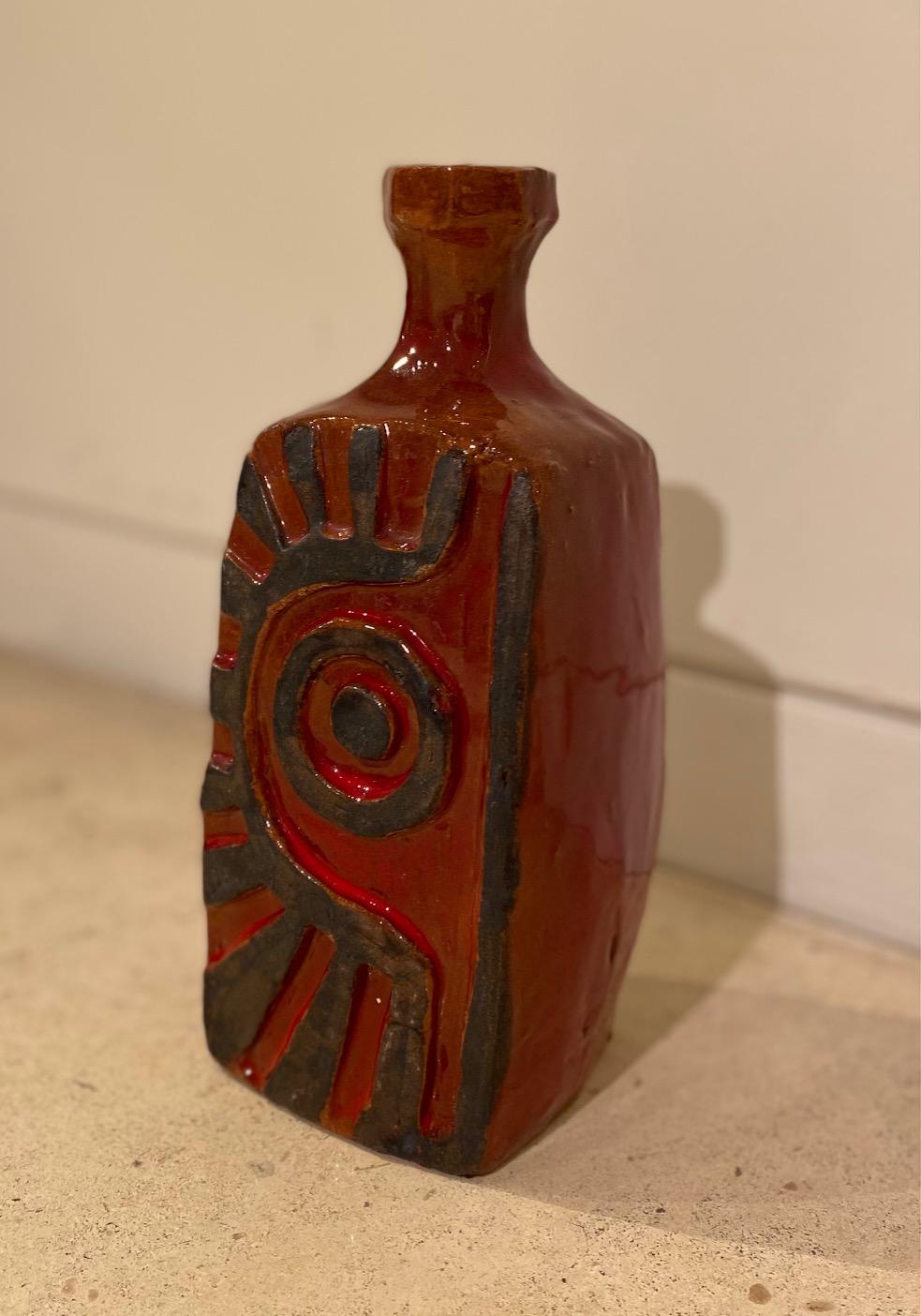 Red Ceramic glazed vase by Charles Sucsan

Charles Sucsan was born in Paris, France to Hungarian parents. The artist studied ceramics and sculpture in Paris, apprenticing at the studio of Florencio Fernandez, a master ceramist and close friend to