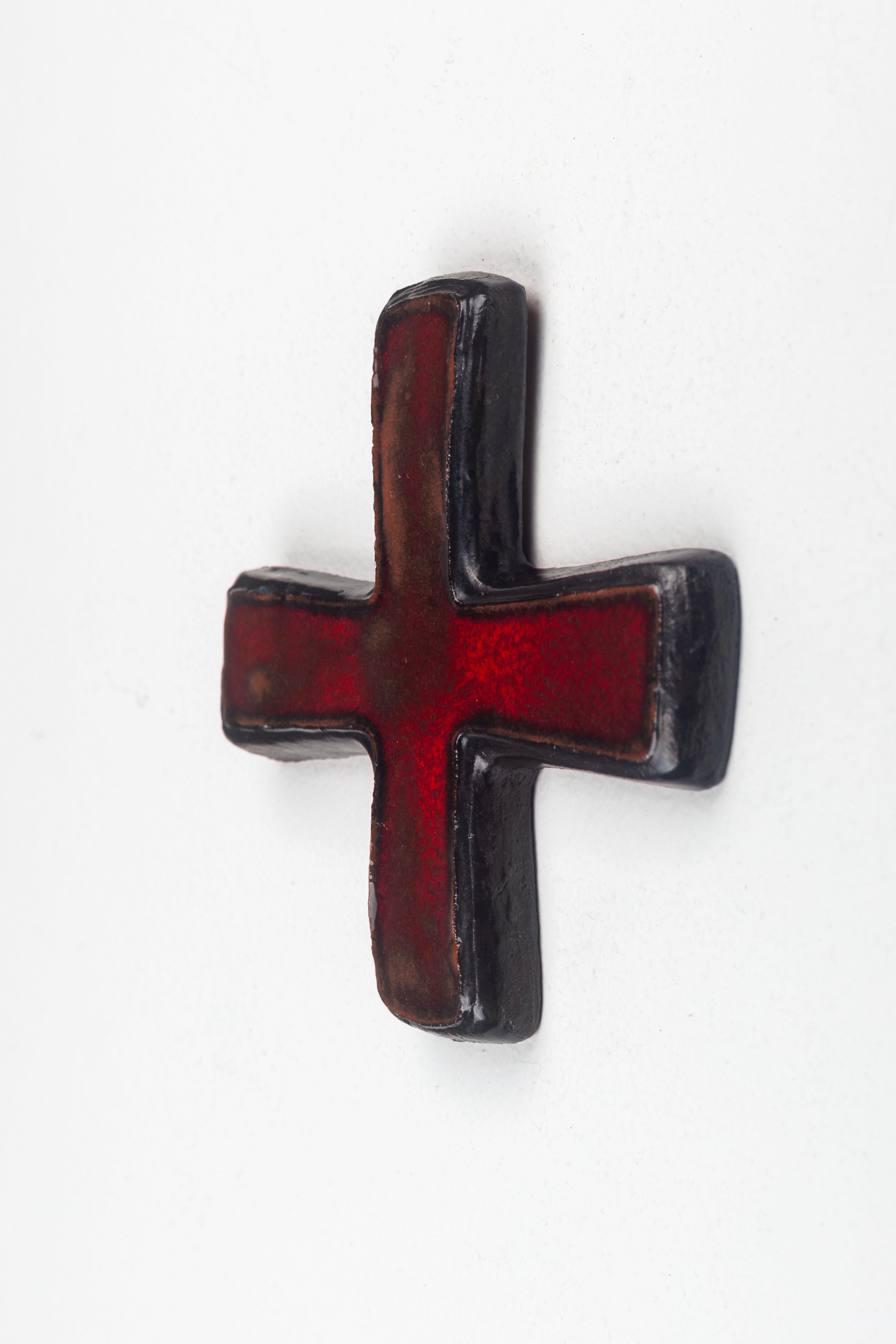 This ceramic cross is a quintessential representation of mid-century modern design, realized by a skilled European studio pottery artist. The cross features a simplistic yet profound silhouette, embodying the minimalist ethos that was prevalent