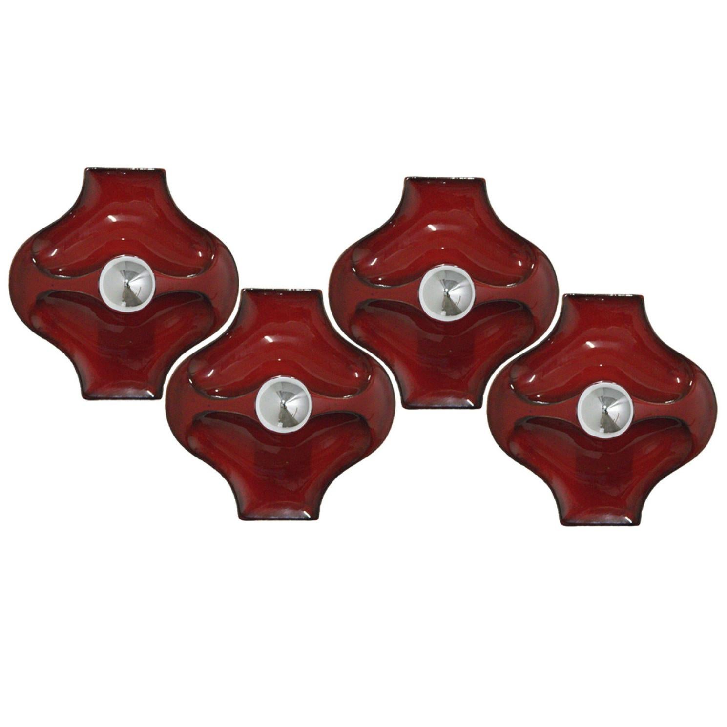 Red ceramic wall lights. Manufactured by Hustadt Leuchten Keramik, Germany in the 1970s.
The glaze is in red. We used silver mirror light bulbs (see images), but soft gold clear or gold mirror light bulbs are also very