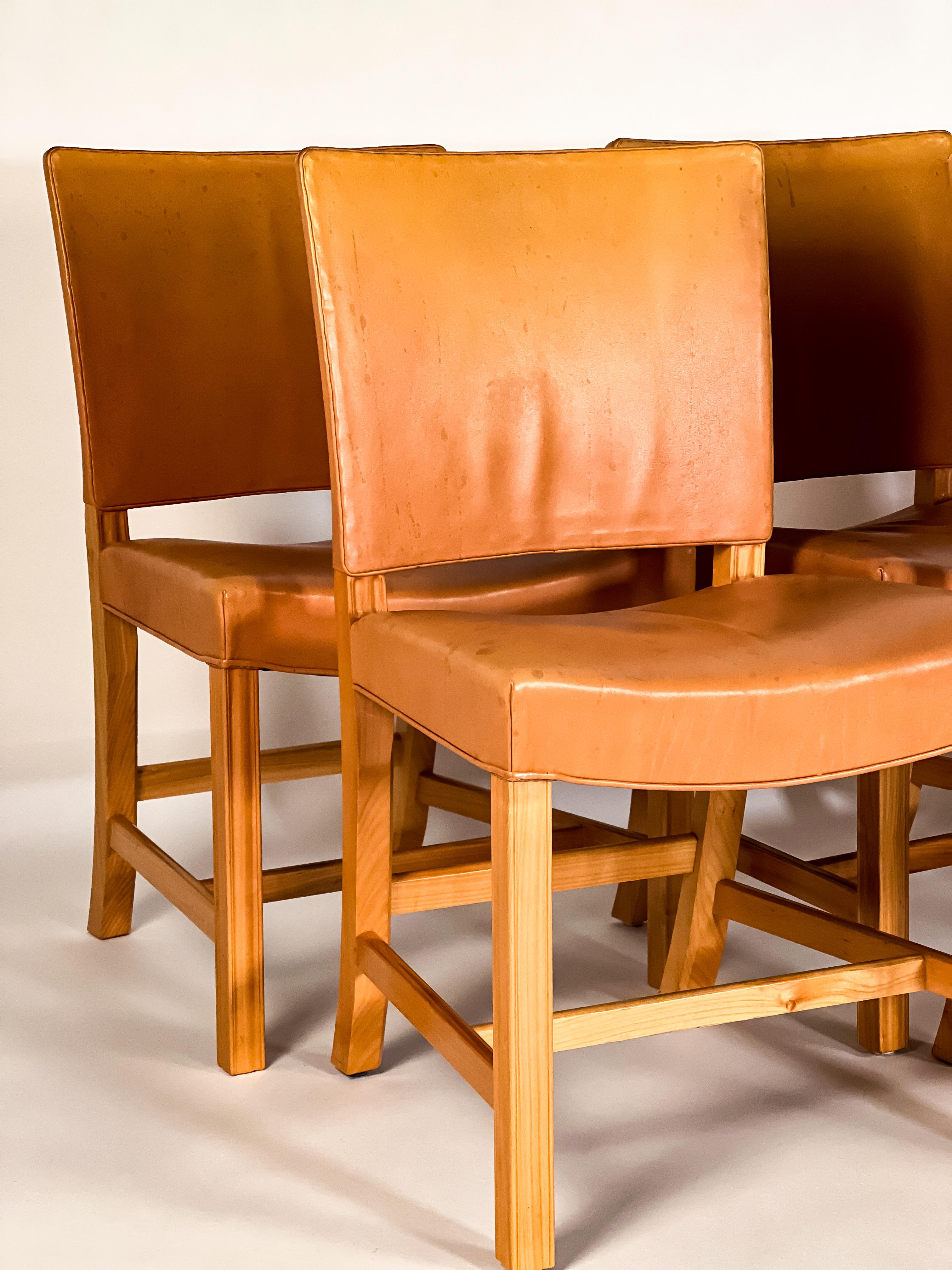 Six ultra-classic “Red” chairs by Kaare Klint for Rud Rasmussen, Denmark. Vegetable tanned full grain leather upholstery has a wonderful patina. The frames appear to be Elm. Excellent vintage condition. Acquired directly from Danish auction house