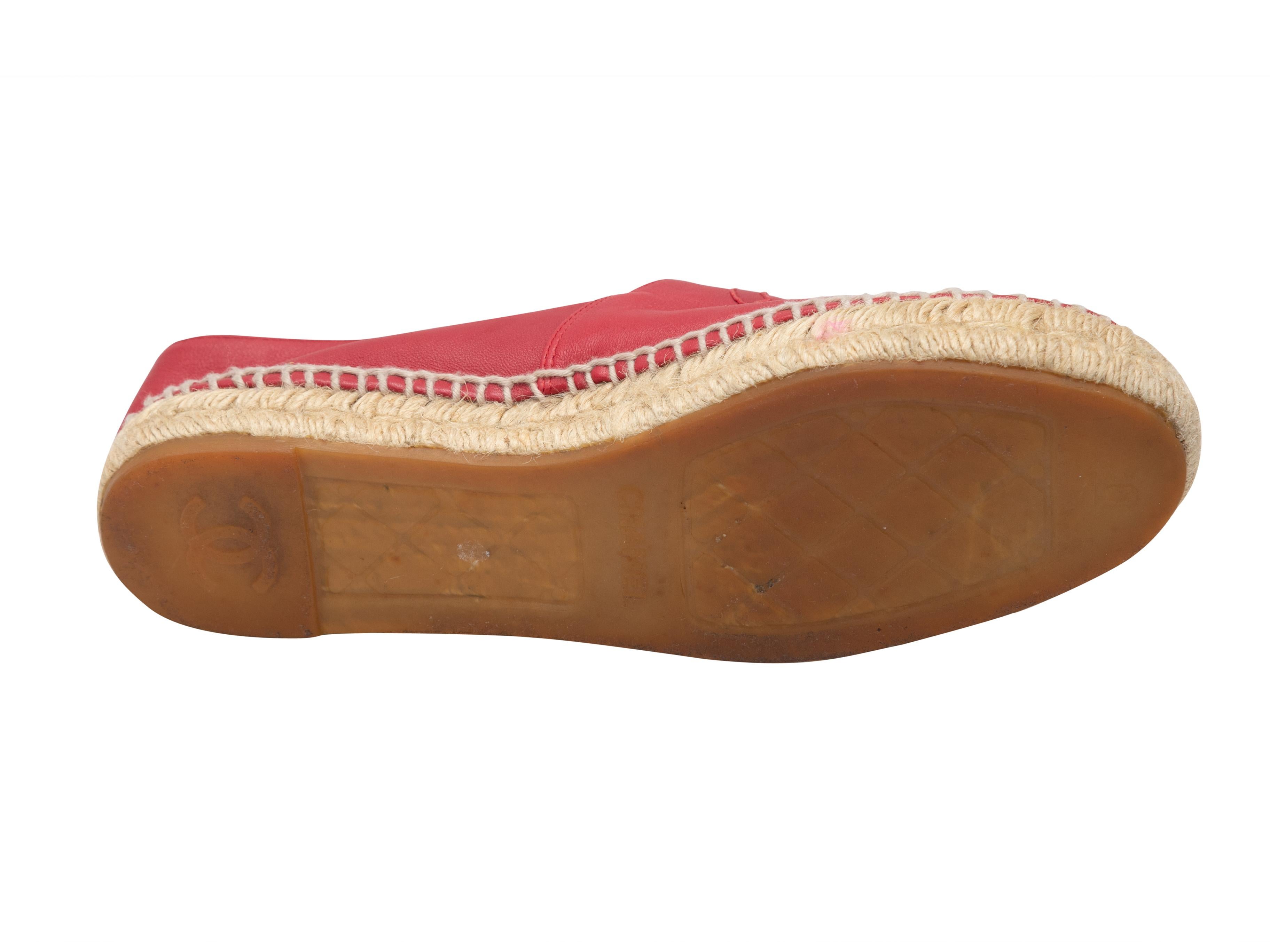 Red leather espadrille flats by Chanel. CC logos at tops. Jute trim at soles. 1