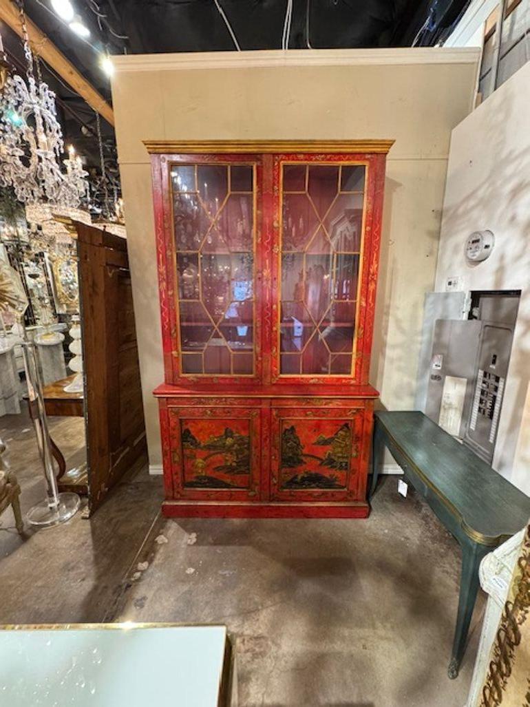 Early 20th century English red chinoiserie cabinet. Circa 1920. A timeless and classic touch for a fine interior. 57w x 19d x 94h