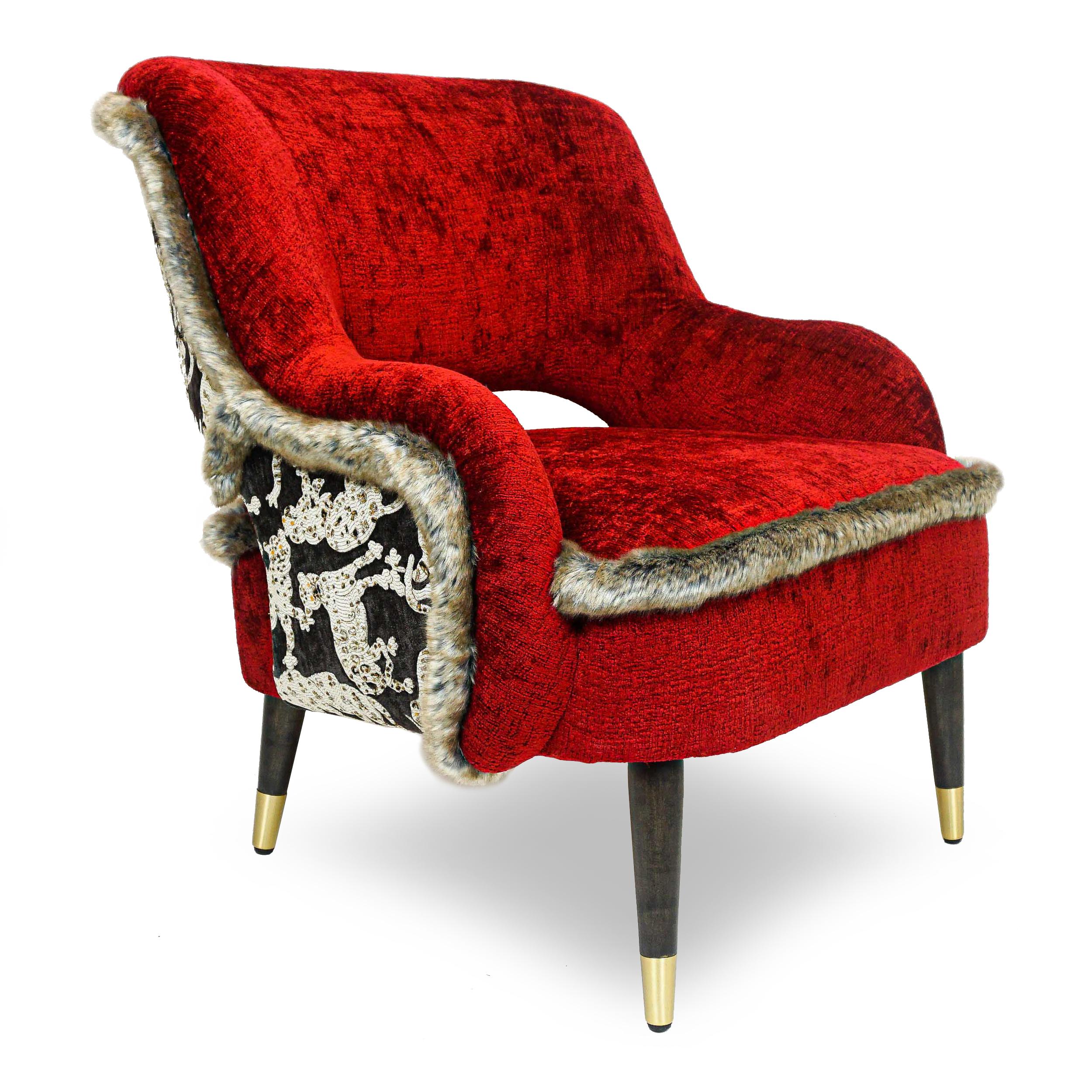 A maximalist combination of fabrics and materials make this chair indulgent and rich. A performance chenille in hot magma red with quilted cat on the outside back and trimmed with cinnamon-sugar colored faux fur cover a solid hard maple frame. Tight