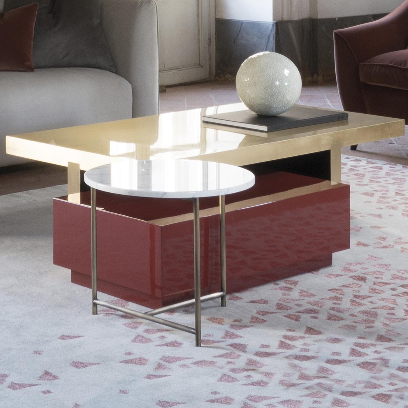 Daring design and color choices make this lavish table a one-of-a-kind addition to any modern-style decor. Inspired by modernist art, the solid silhouette is cleverly created by superimposing two concentric rectangles, the larger one acting as the