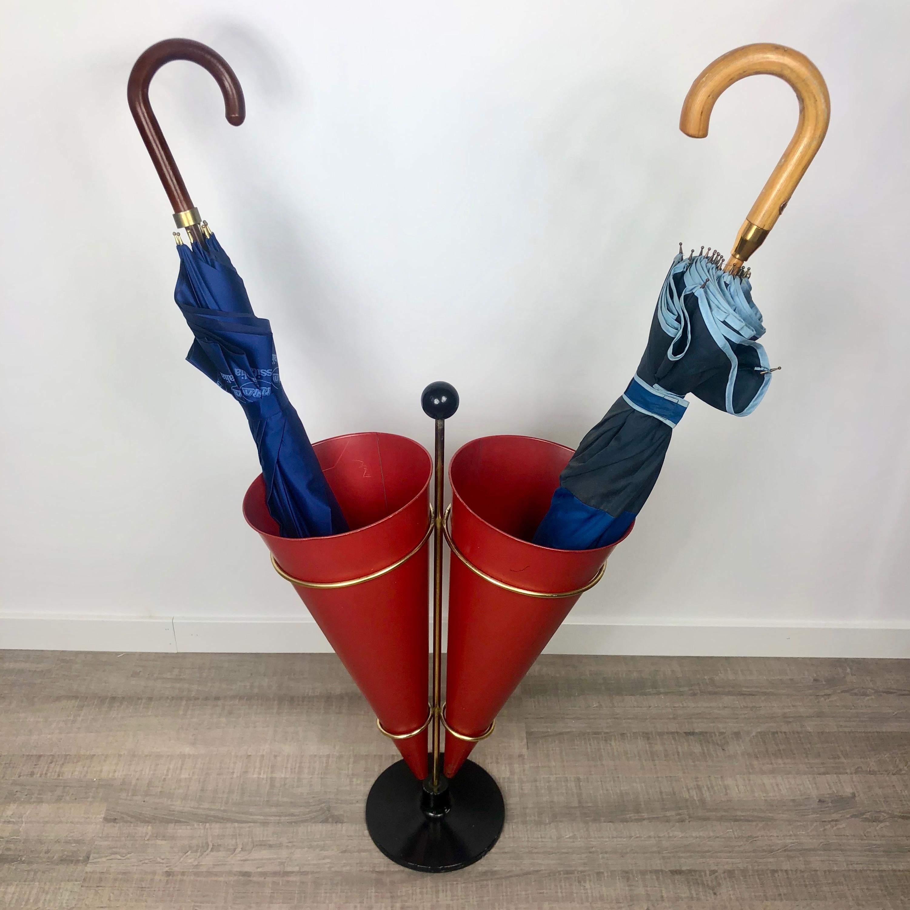 Umbrella stand in a metal and brass structure featuring two red cones as rackets. Made by Vitra (the original stamp is clearly visibile) – Italy, circa 1970.
Conditions are good and all the signs of time the item presents are shown in the photos.