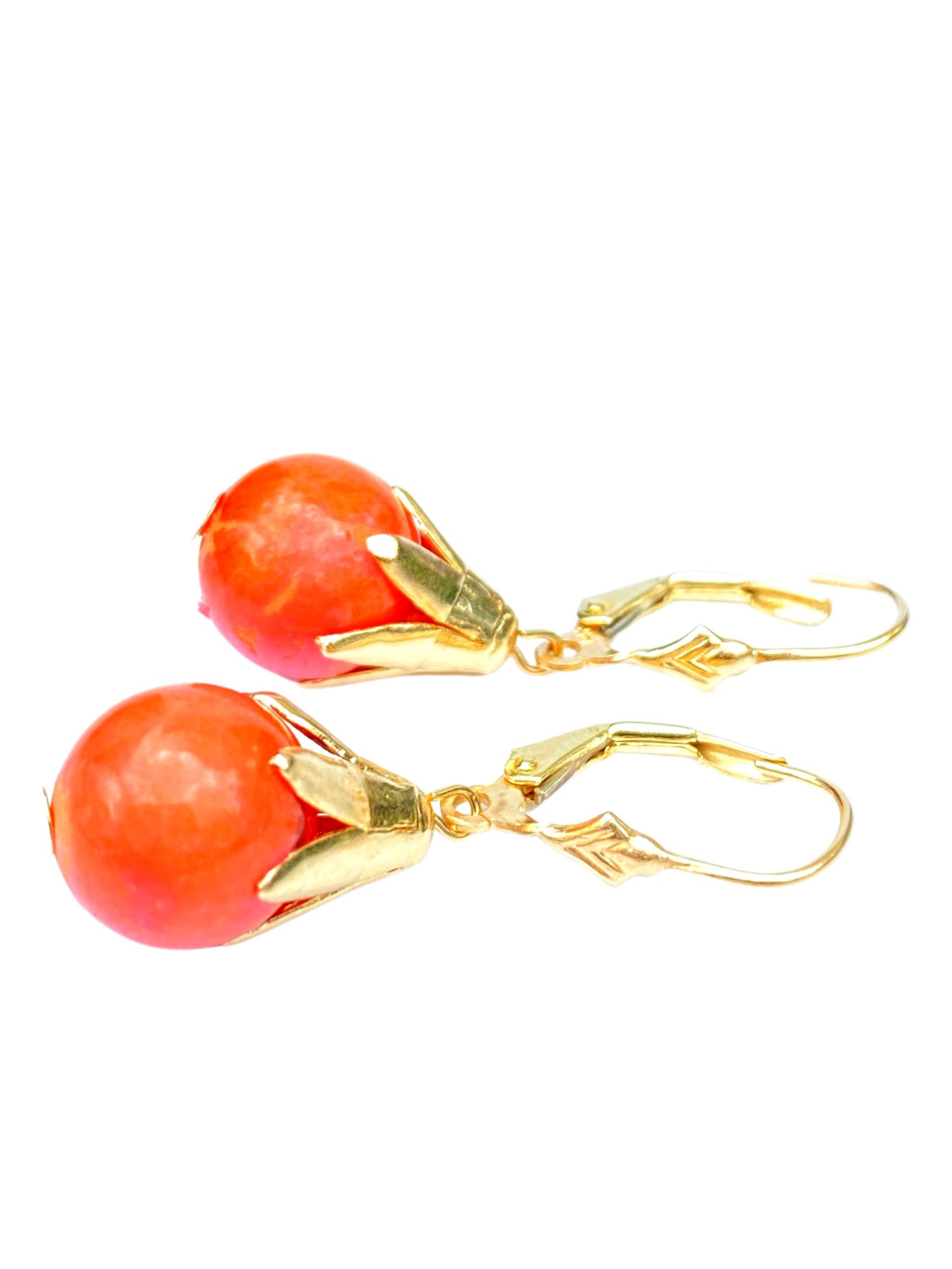 Centering two Red Coral drops and set in 4.6 grams of Yellow Gold. 

Details:
✔ Stone: Red Coral 
✔ Stone Cut: Pearl
✔ Stone Color: Red
✔ Earrings: 14K Yellow Gold, 
✔ Era: 1980's
✔ Metal: 14K Yellow Gold
✔ Total Earring Weight (Grams): 4.6 Grams
