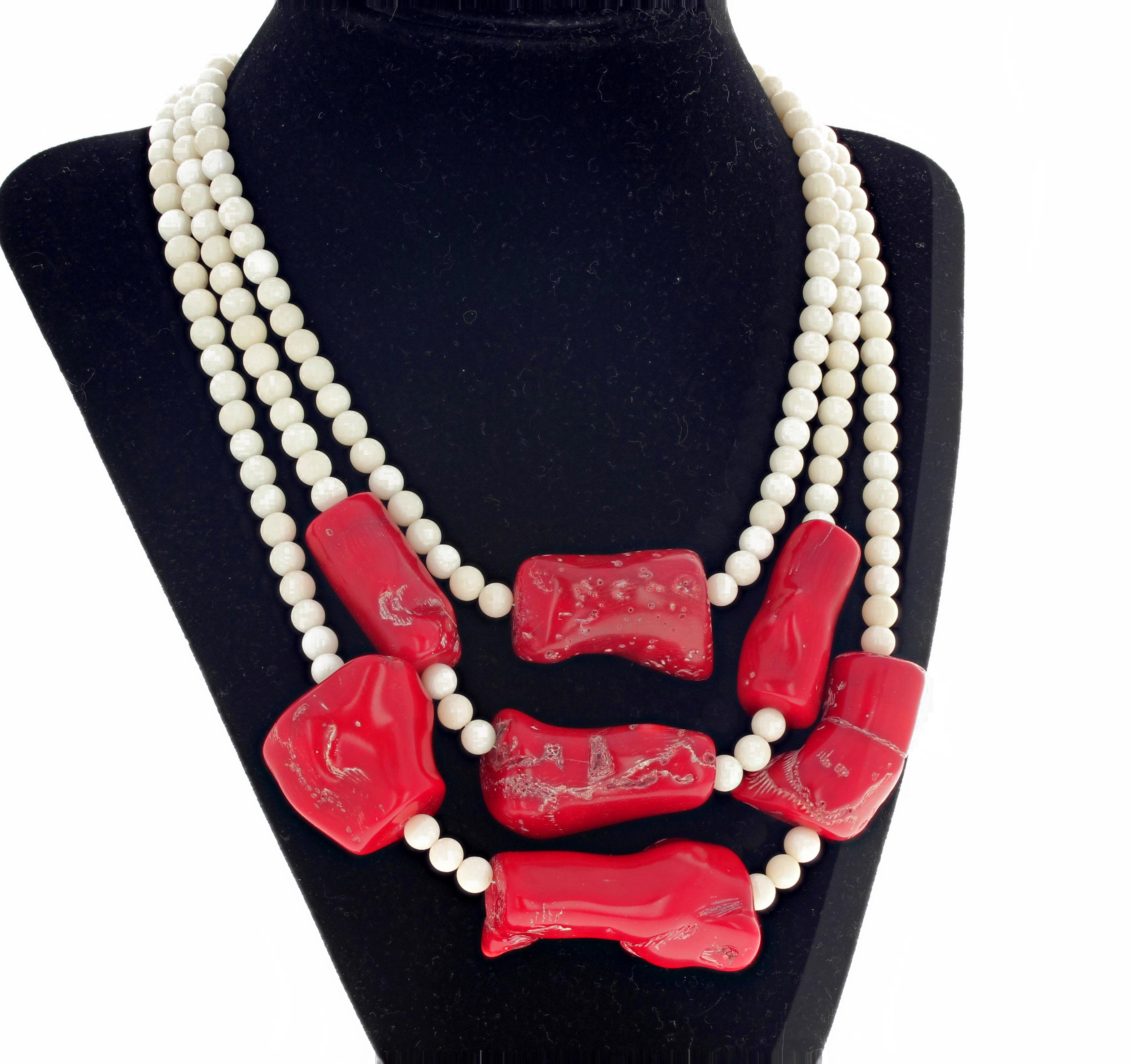 Glamorous statement making triple strand of White Coral enhanced with chunks of highly glowing natural Red Bamboo Coral hangs from 16.25 inches (short strand) to 20 inches (longest strand).  The largest piece is approximately 1 3/4 inches long by 1