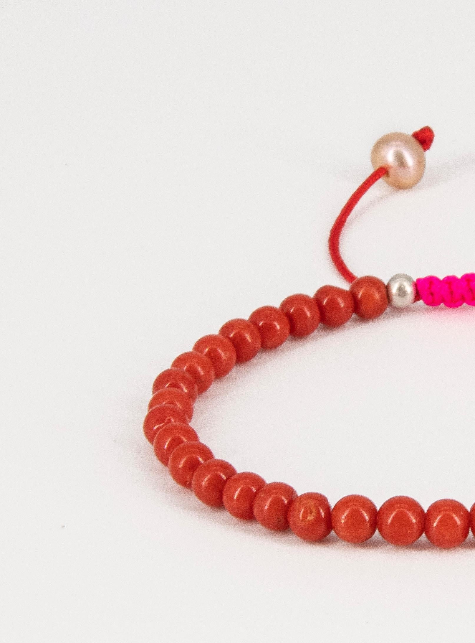 Women's or Men's Red coral bracelet with neon pink drawstring closure and freshwater pearls For Sale