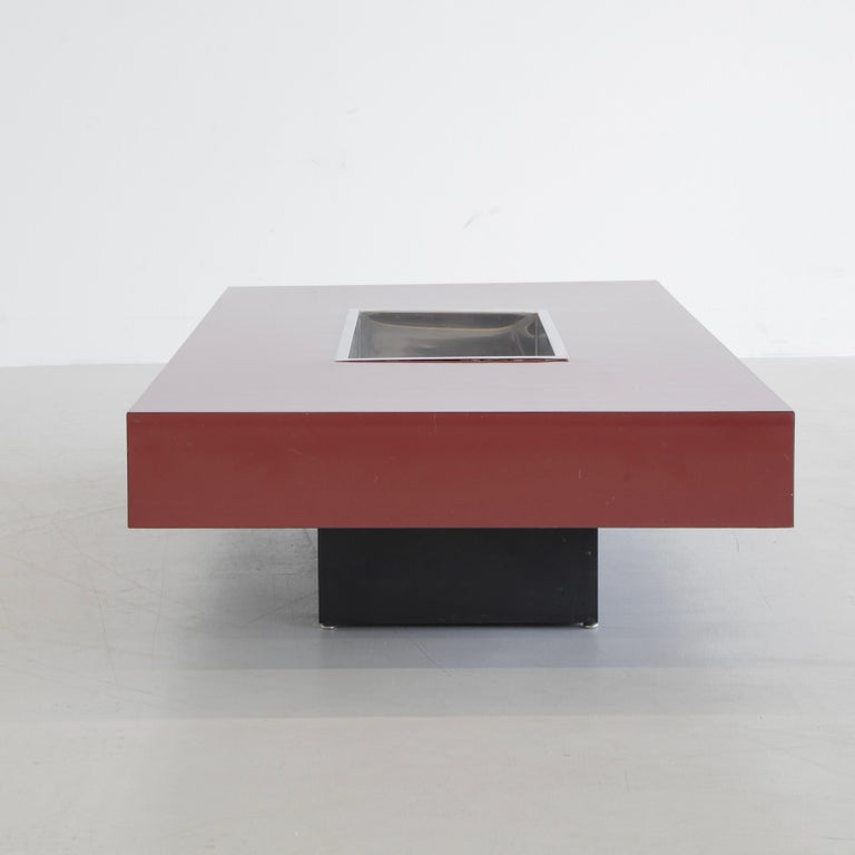 Coffee table, designed by Willy Rizzo in 1971. France, Willy Rizzo.

Red coral colored Formica covered wooden table construction with an inserted stainless steel tray/ bucket and chromed corner pieces.
Condition: 

Good condition, some marks