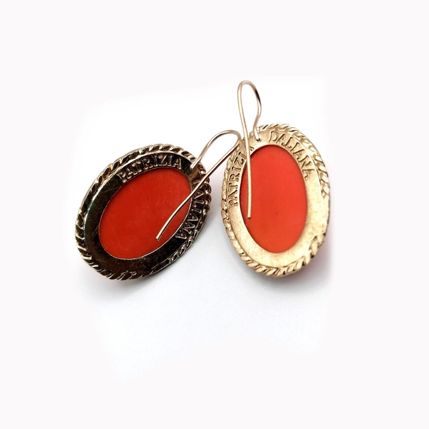 Bronze earrings, with Cameo Murano glass, representing ancient Roman woman's head. For the ear is used a bronze wire properly modeled. To fix the stones to our jewels, according to the Italian goldsmith's tradition, we use the technique of setting