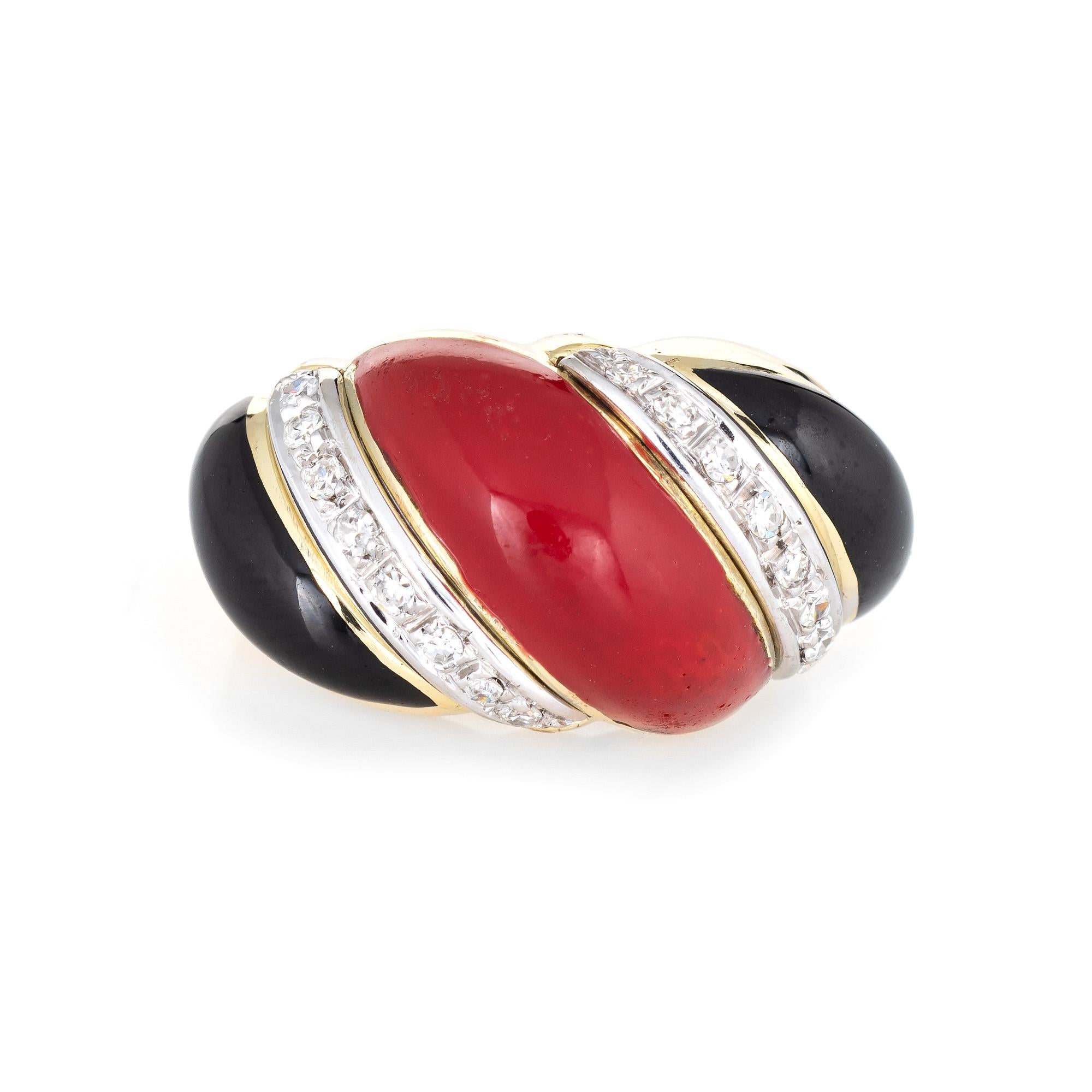 Stylish vintage Sardinian red coral, onyx & diamond cocktail ring (circa 1960s to 1970s) crafted in 18 karat yellow gold. 

Coral & onyx measures 20mm x 6mm (center coral) and 15mm x 4mm (outer onyx). The diamonds total an estimated 0.16 carats