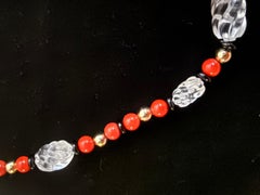 Red coral, rock crystal, gold and black onyx rondelle.