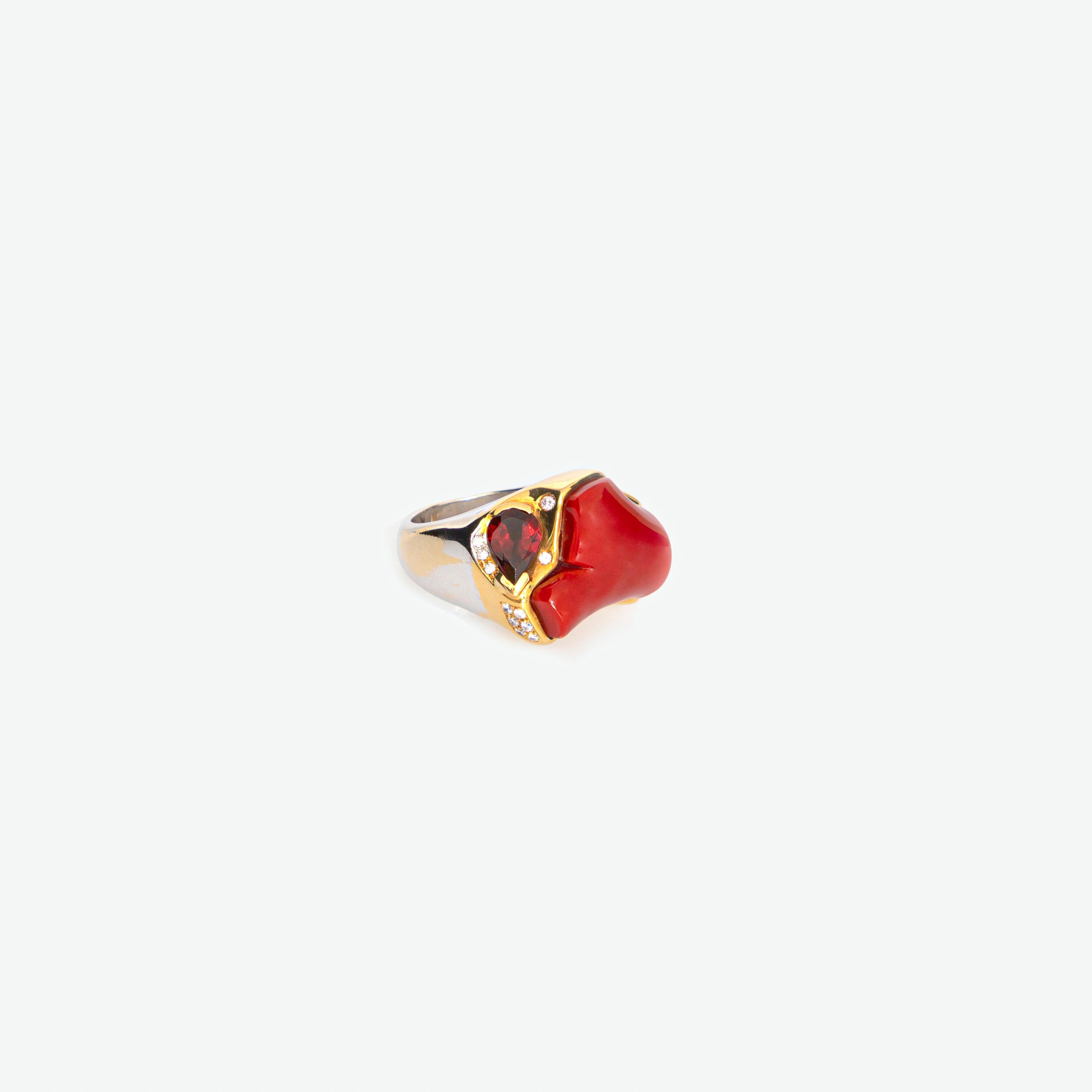 Rare and magnificent natural coral and almandine garnet gem surrounded by a mixed yellow-white gold ring embellished with diamonds. 

• 18k yellow-mix-white gold
• Carat total weight of diamonds 0.38 over 17 gems
• Total weight 28 g
• Size: 7 (US),