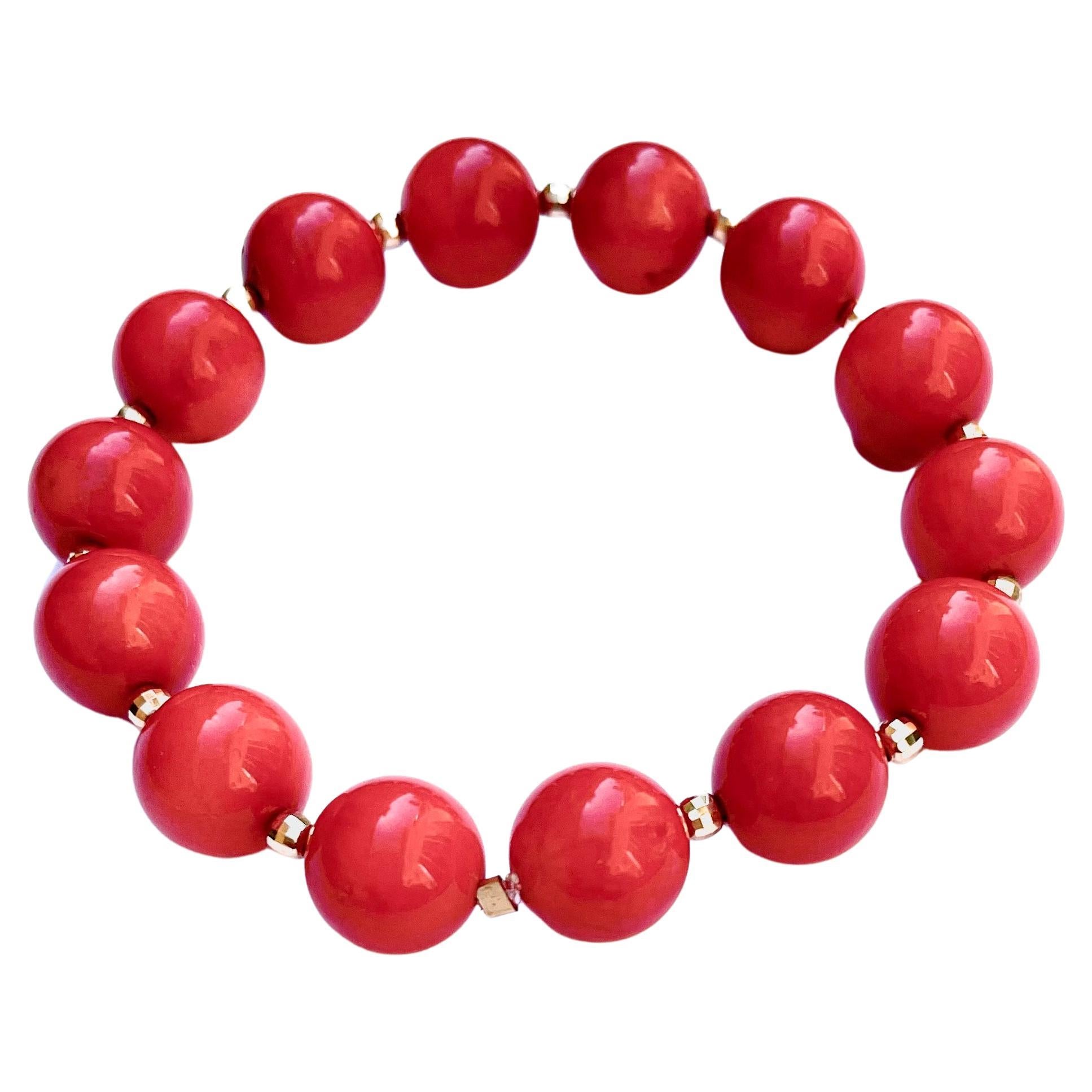 Description
Vibrant red Coral with 14k yellow gold faceted balls stretchy bracelet. Order 2 and stack them for a more stunning all season look.
Item # B1272

Materials and Weight
Coral 127 carats, 11mm, round beads.
Faceted balls 3mm 14k yellow