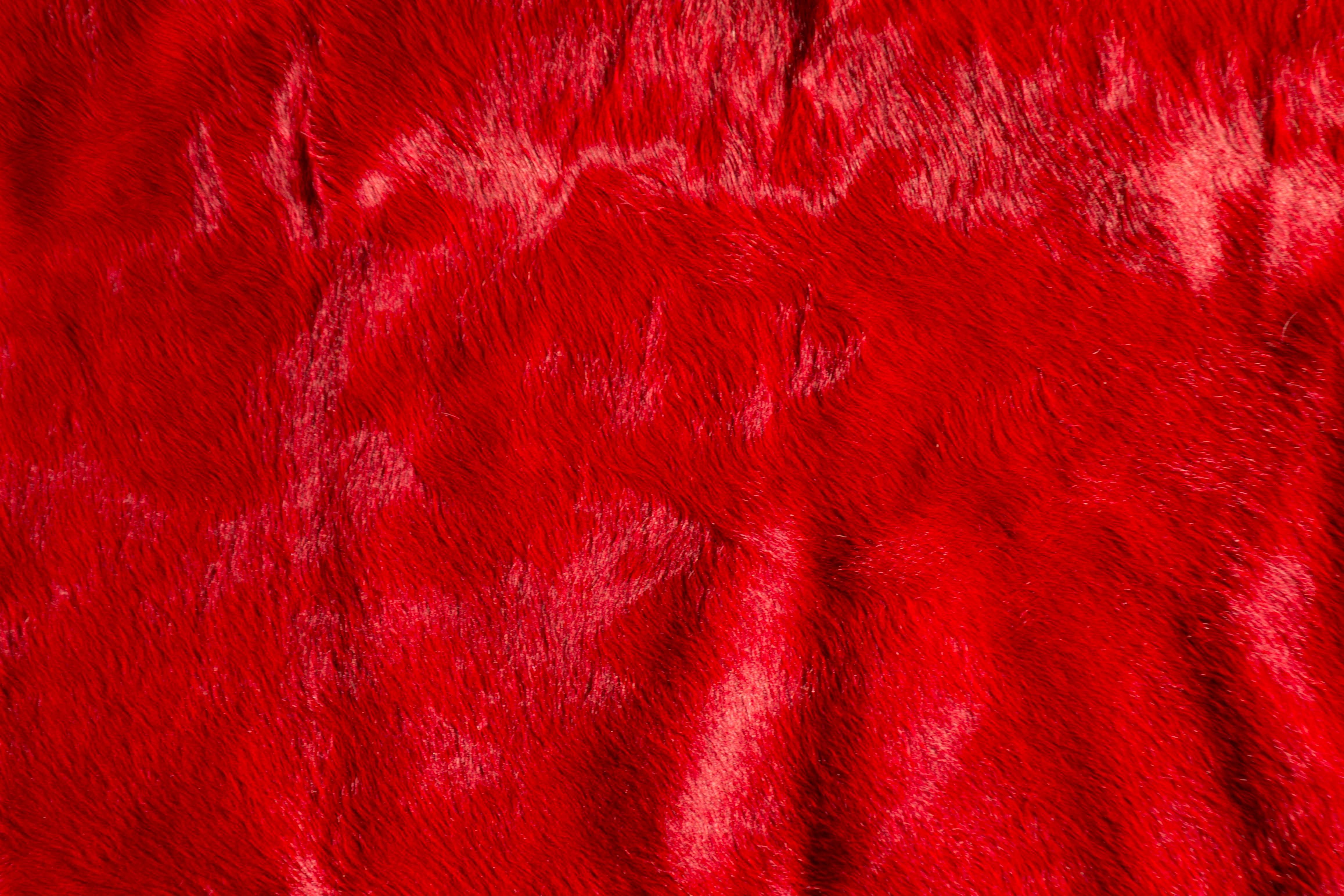 red cowhide rug