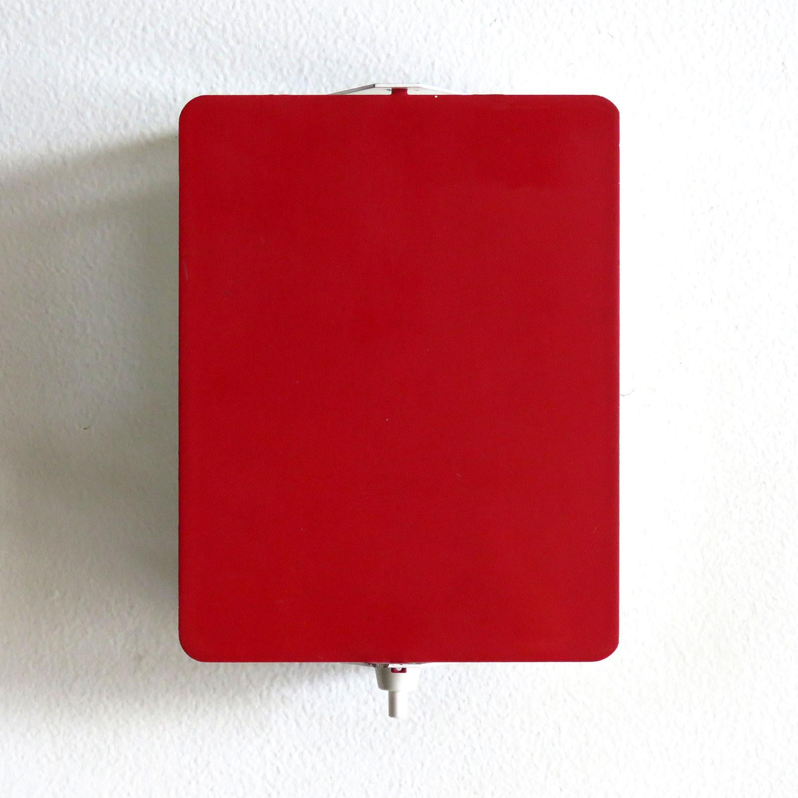 Iconic enameled wall lights by Charlotte Perriand with adjustable reflectors in rare red finish, optional horizontal or vertical mount, manufactured and distributed by Steph Simon, Paris, marked, wired for US standards, one E12 socket each, max.