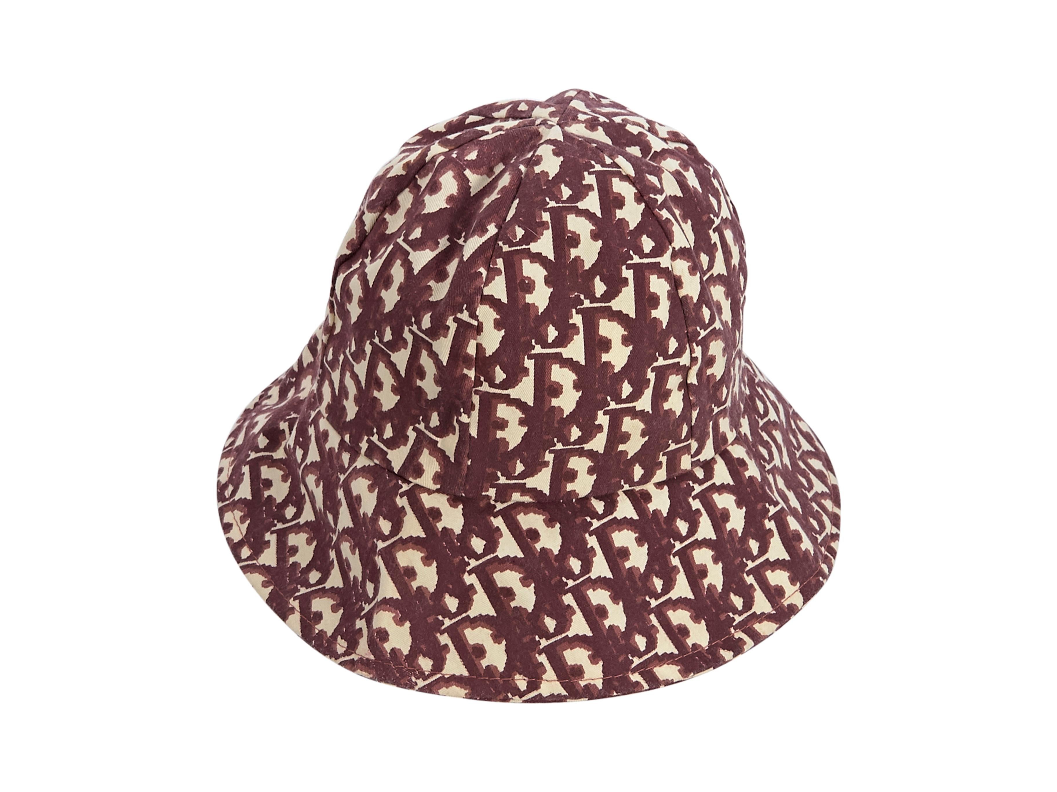 Product details:  Vintage red and cream Diorissimo bucket hat by Christian Dior.  Water repellent design.  Lined interior.  25.25