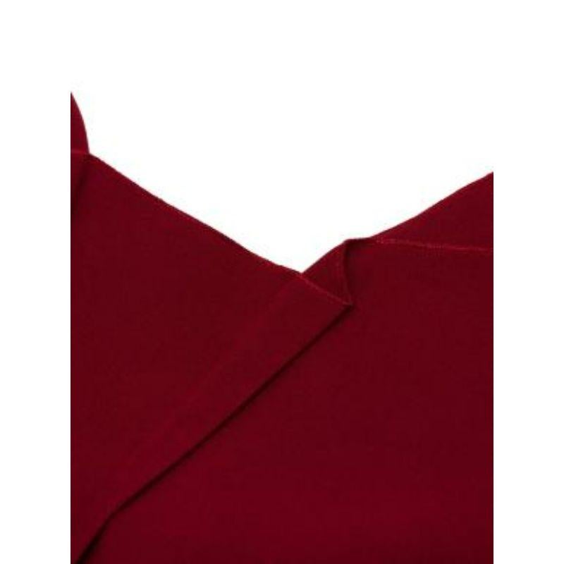 Roland Mouret red wool crepe pencil dress
 
 
 
 - Rich ruby red hue in textured lightweight crepe
 
 - Signature form-fitting silhouette with draped accents
 
 - Cap sleeve, V-back with concealed zip fastening
 
 - Back slit skirt
 
 
 
 Materials
