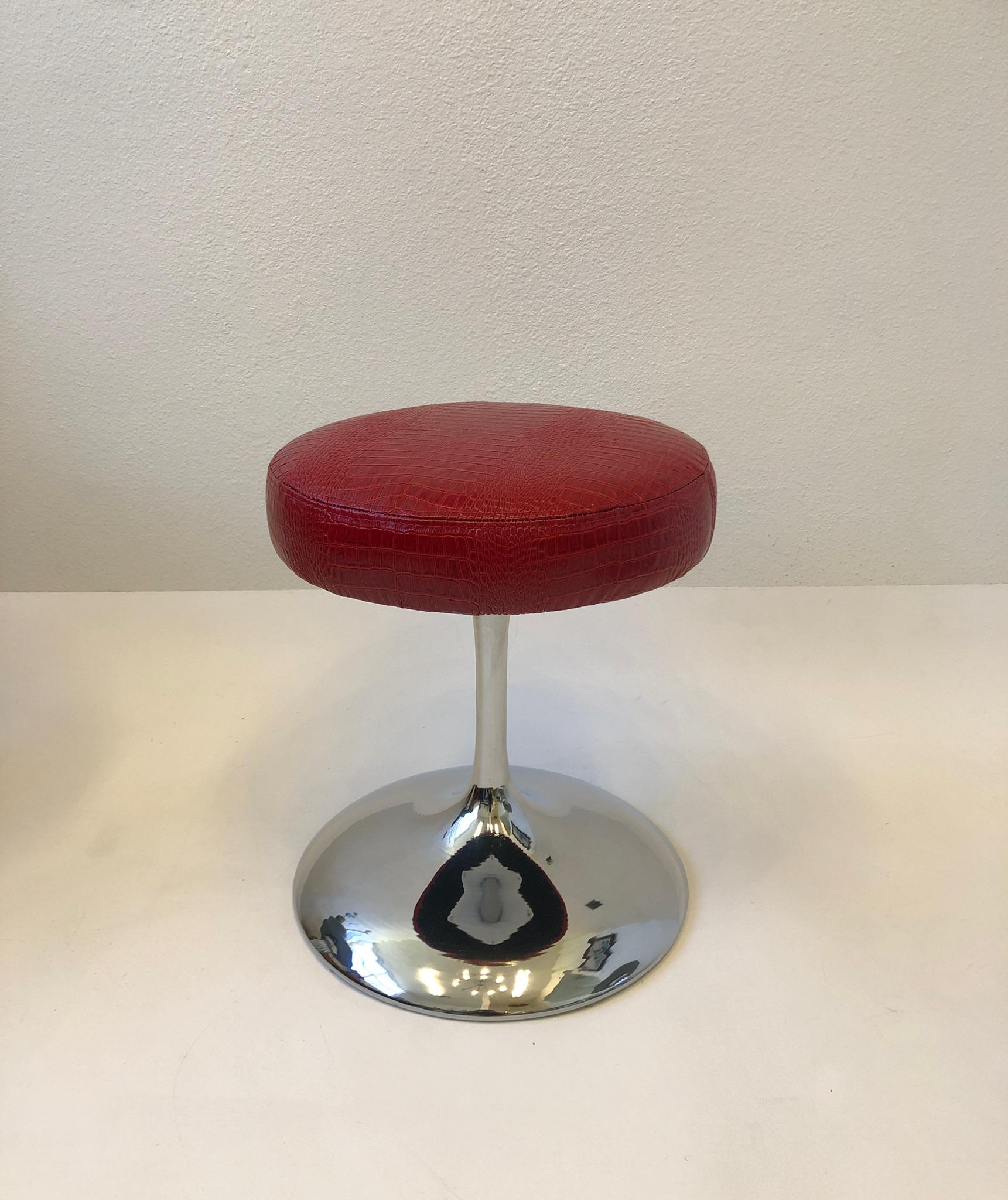 1970’s Polish chrome swivel stool with red Crocodile patent leather seat.
Newly recovered.
Measurements: 19” High, 16” Diameter.