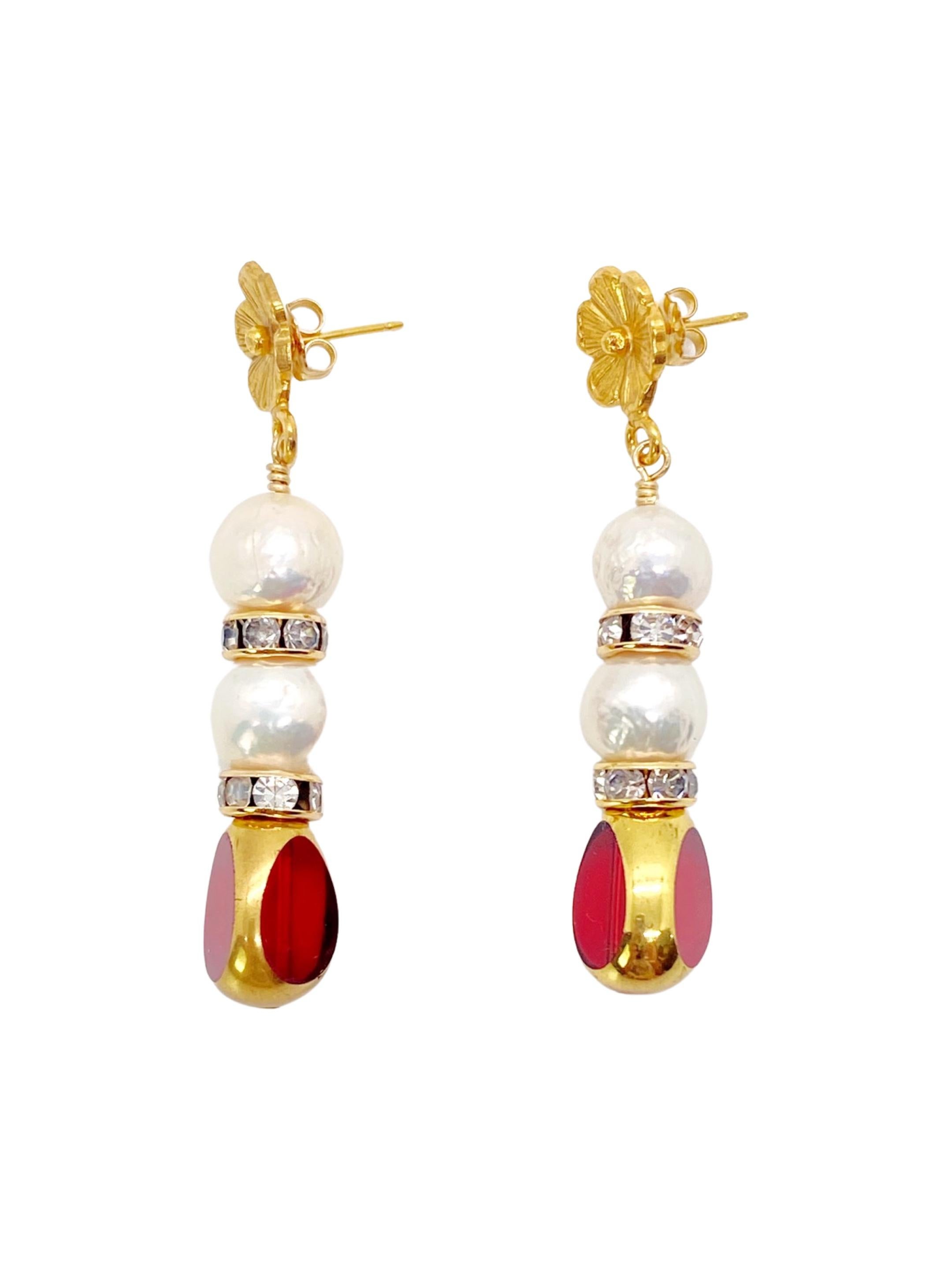 This is for a pair of earrings. Red transparent vintage German glass beads edged with 24K gold are complimented with freshwater pearls. The earrings are finished with 24K gold plated floral earring post and 14K gold filled rhinestones spacers.

The