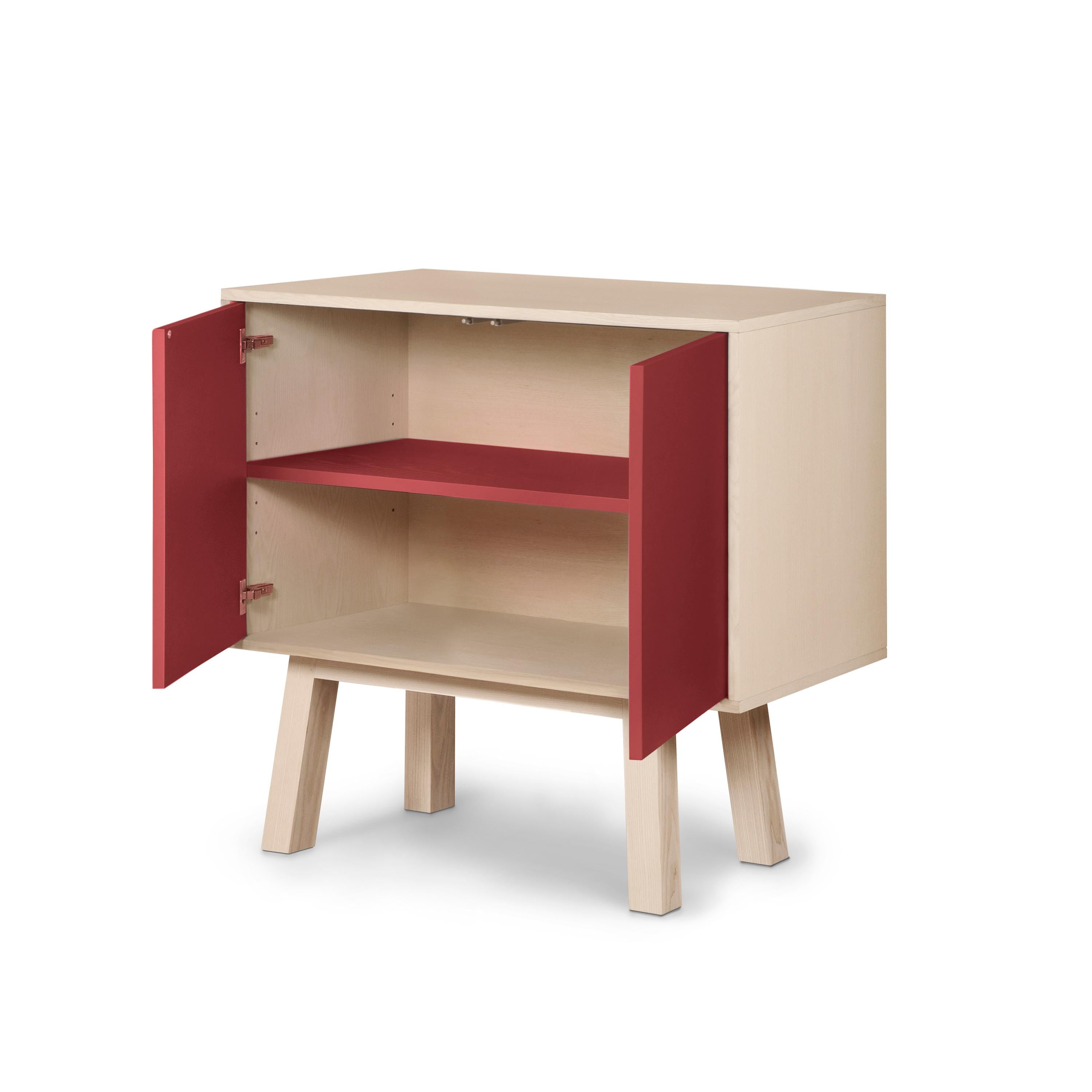 This 2-door cabinet is designed by Eric Gizard, Paris and 100% handcrafted in France.

It is made of French solid ash wood, veneer adh and lacquered doors in MDF panels. 

The 2 doors open with a 