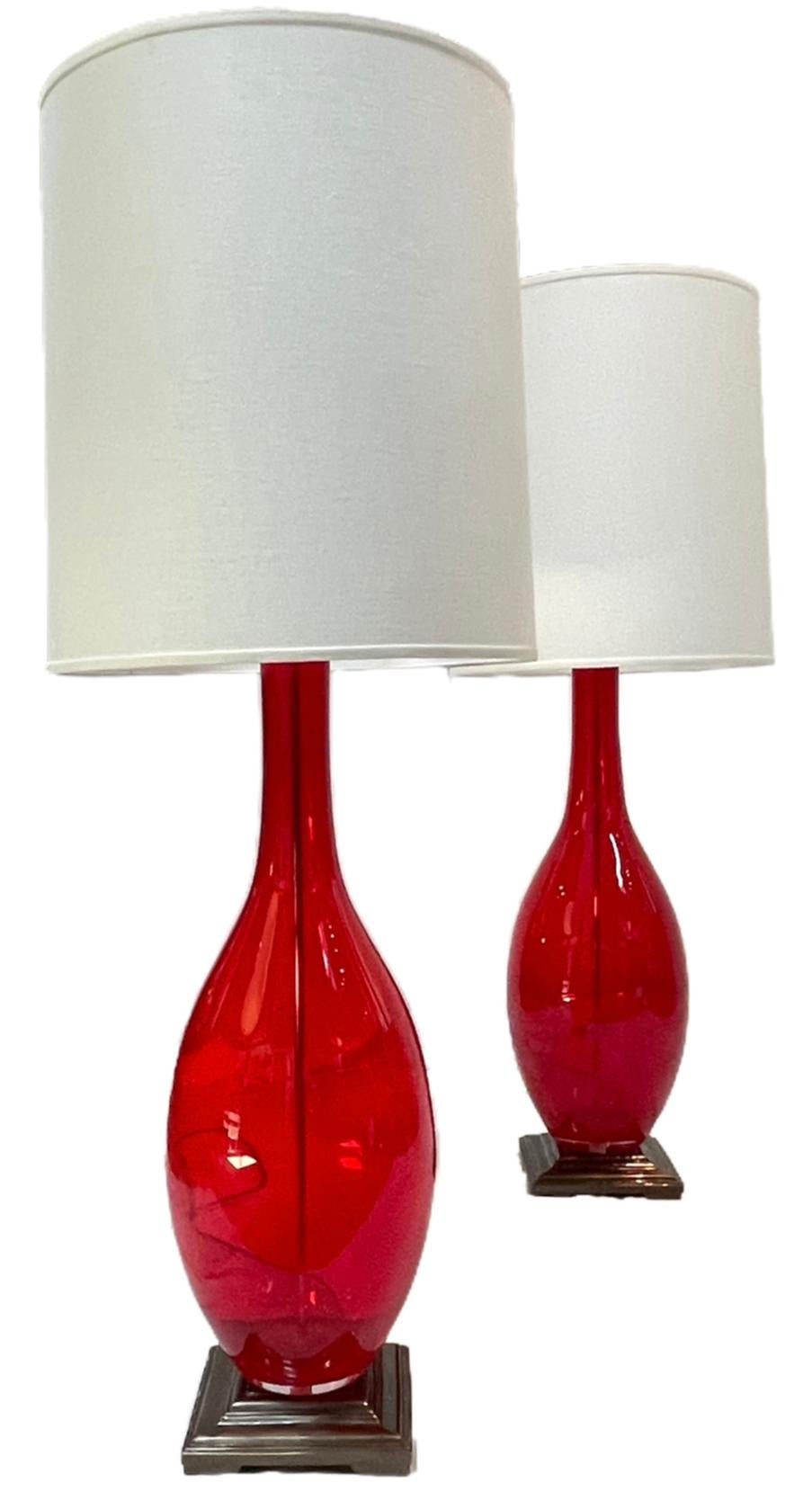 Big, beautiful, and bold! Standing at over 4 ft high, these lamps demand the attention of any space. 
Design Guild art glass table lamps. Made in Poland, 20th century

Measures: 49”H x 10.5”W x 18”D

18” diameter of shade.
