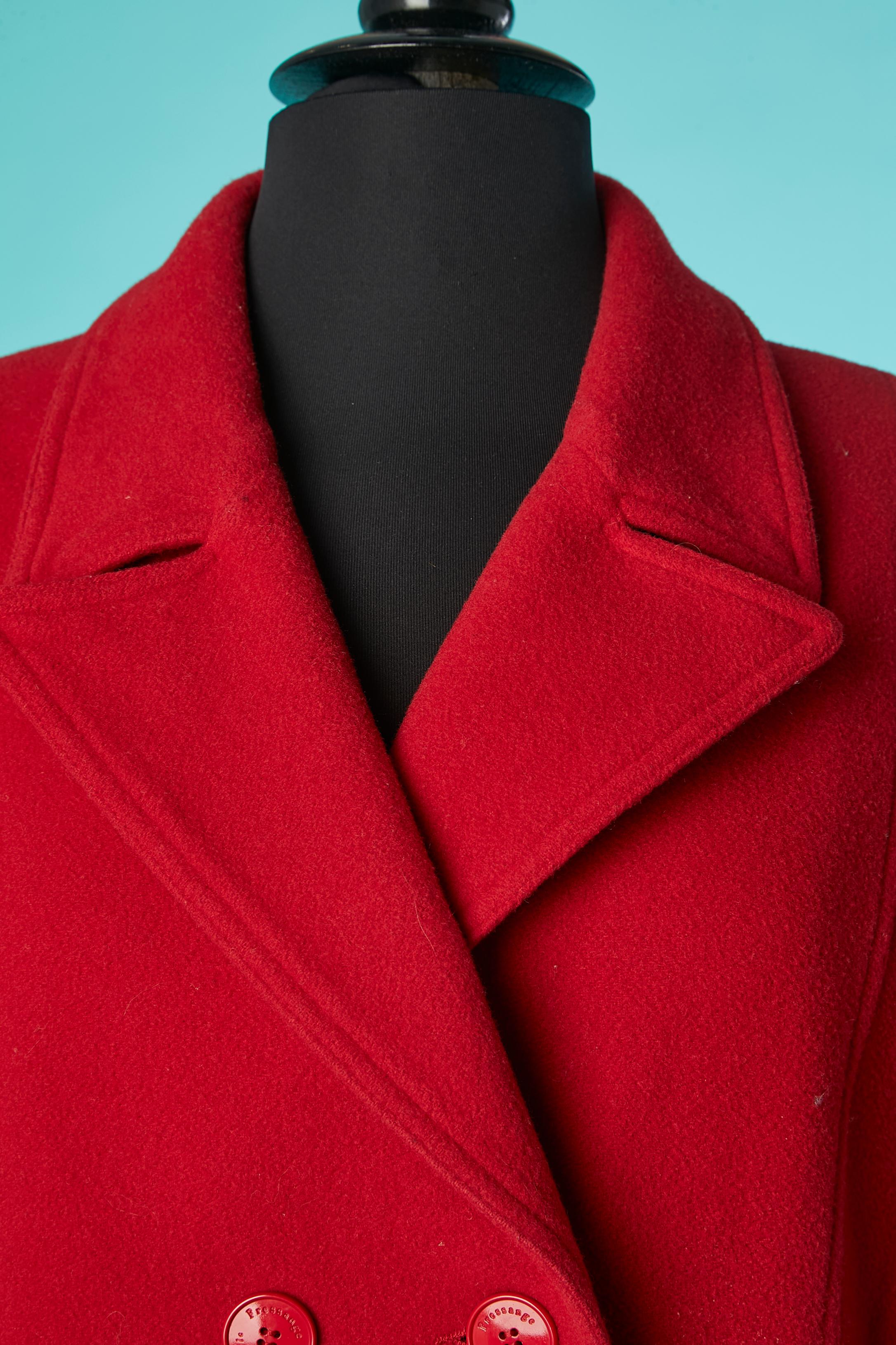Red double-breasted coat in wool. Main fabric composition: 70% wool, 20% polyamide, 10% cashmere. Lining: polyester and rayon. Branded button. Half-belt on the back. 
SIZE 46 (Fr) XL 