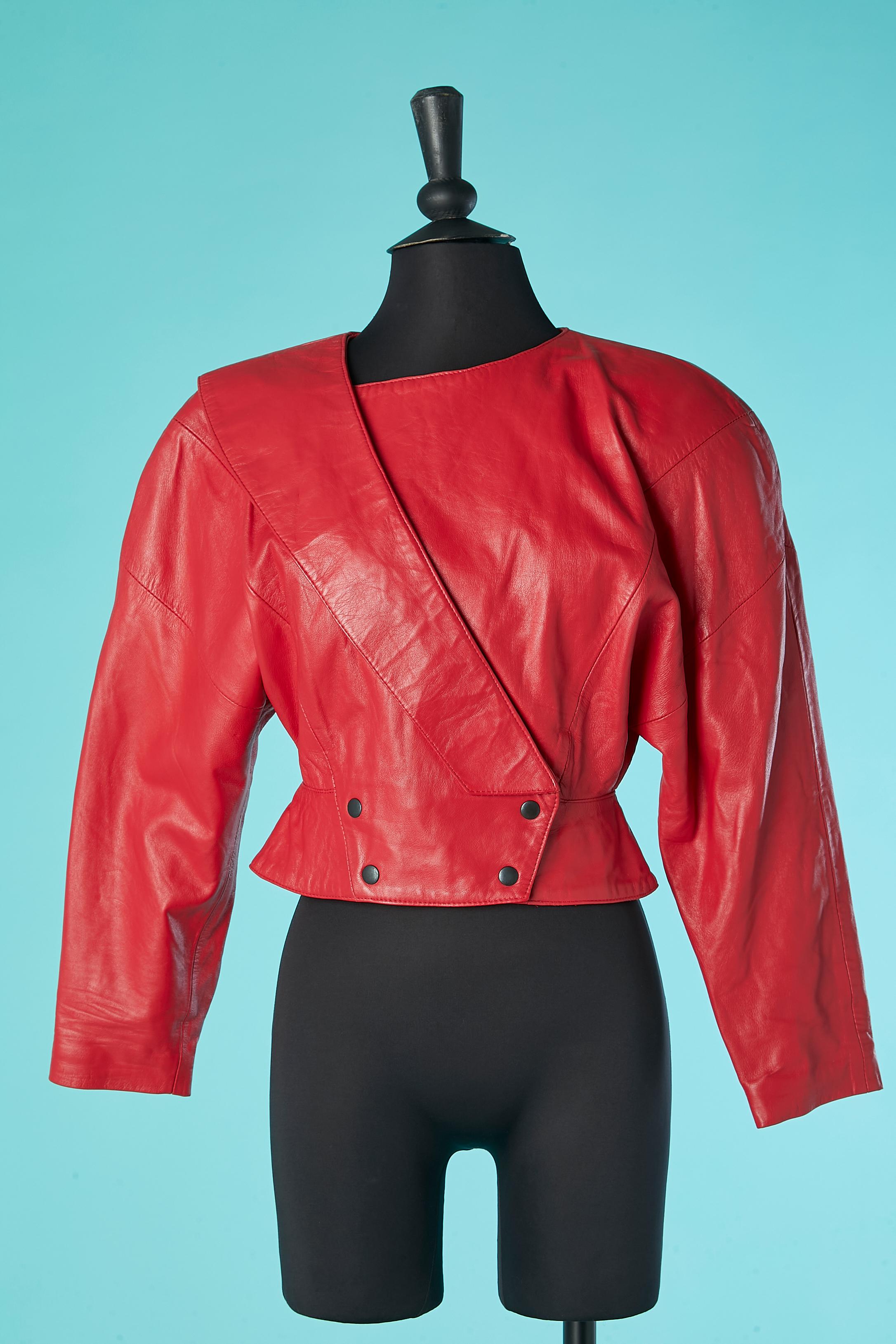 Red double-breasted leather jacket with snap. Main fabric: genuine leather. Lining: rayon.  Raglan. Cut-work. Large shoulder-pad. 
SIZE XS 