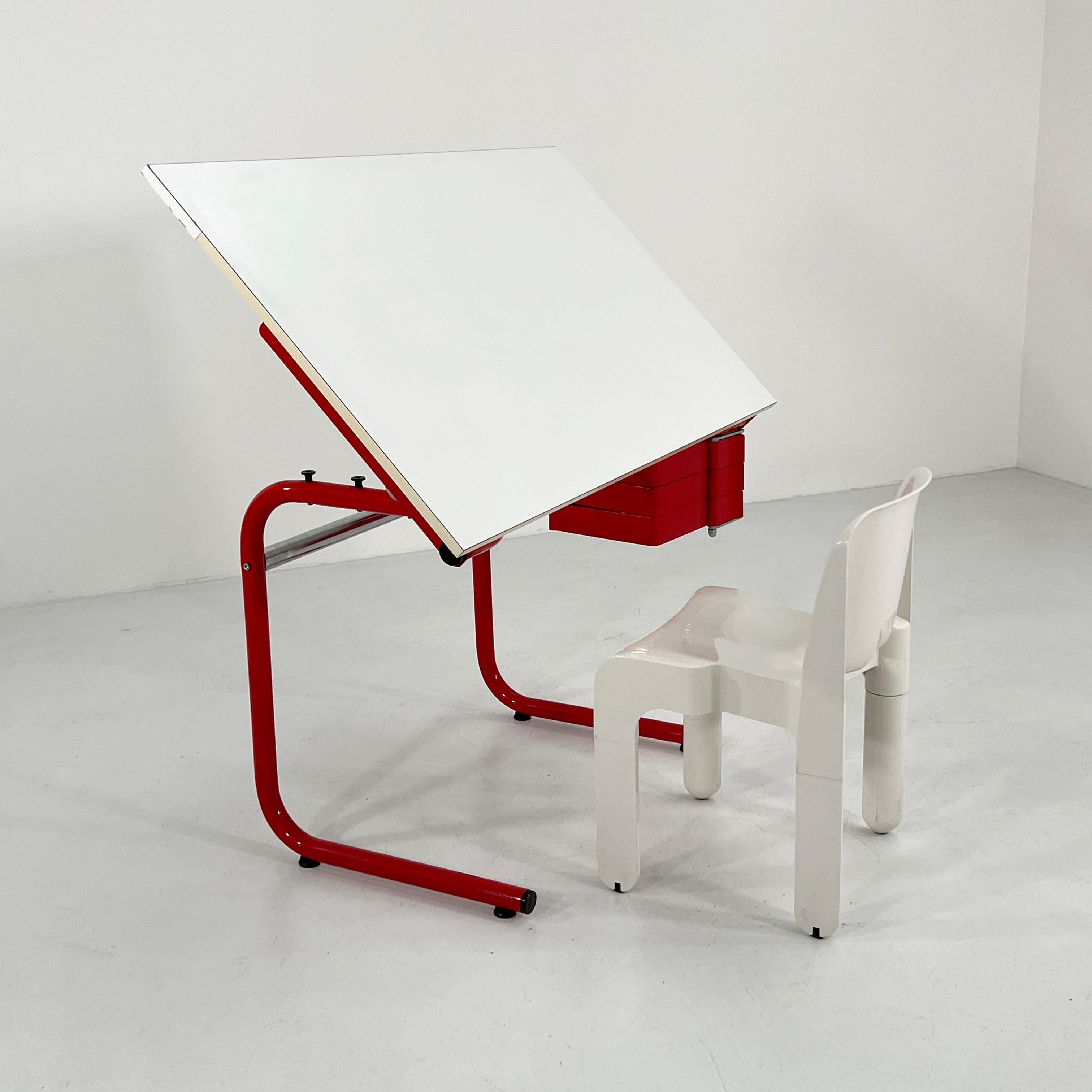 Designer - Joe Colombo 
Producer - Bieffeplast
Model - Drafting Table/Desk
Design Period - Seventies
Measurements - Width 125 cm x Depth 74 cm x Height 75 cm
Materials - Laminated, Metal, Plastic
Color - Red, White 
Light wear consistent with