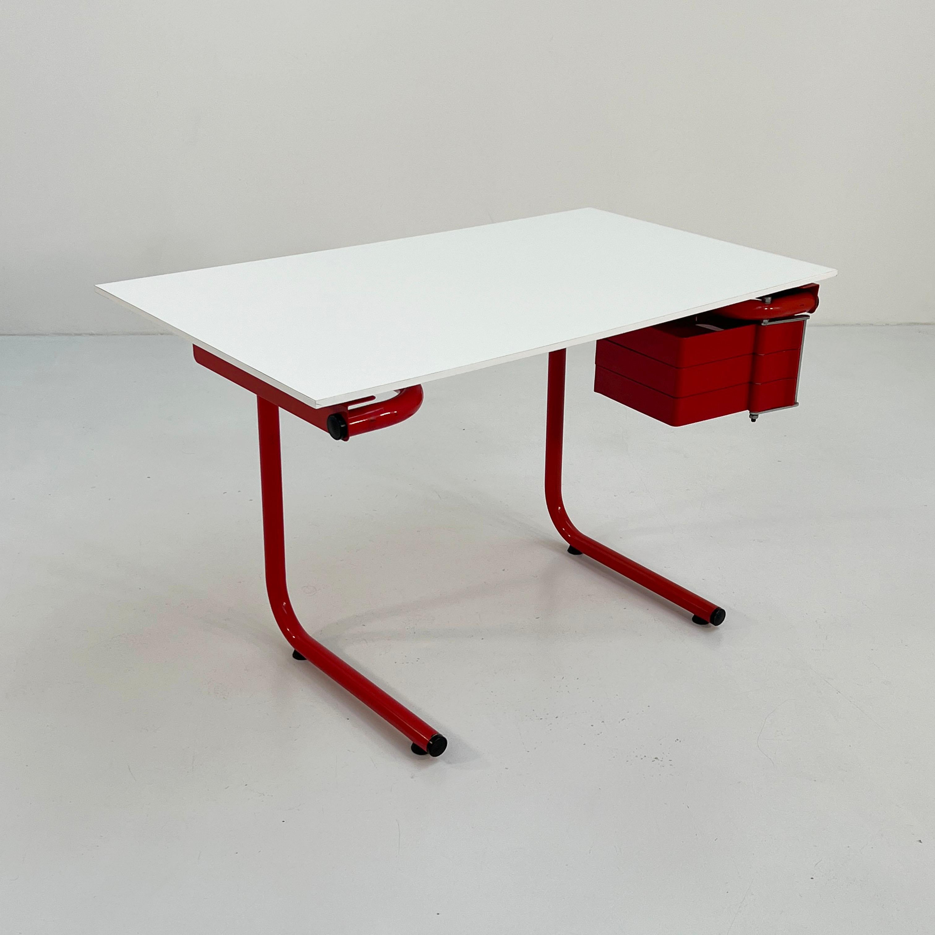 Designer - Joe Colombo 
Producer - Bieffeplast
Model - Drafting Table/Desk
Design Period - Seventies
Measurements - Width 122 cm x Depth 63 cm x Height 75 cm
Materials - Laminated, Metal, Plastic
Color - Red, White 
Comments - Light wear consistent