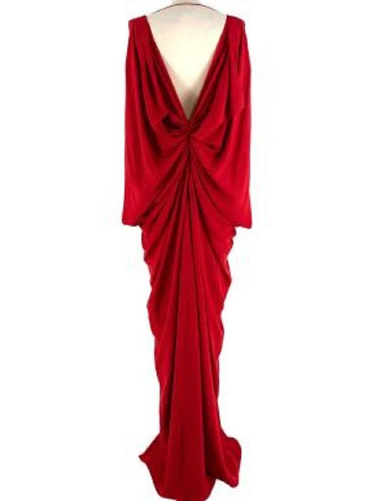 Dior Red Draped Silk Gown
 

 - Mid weight, fluid silk 
 - Gathered centre
 - Draped fluid material 
 - Sleeveless 
 - Low V back 
 - Floor length 
 - Covered button and rouleau hoop side fastening 
 

 Materials: 
 100% Silk 
 

 Made in France 
