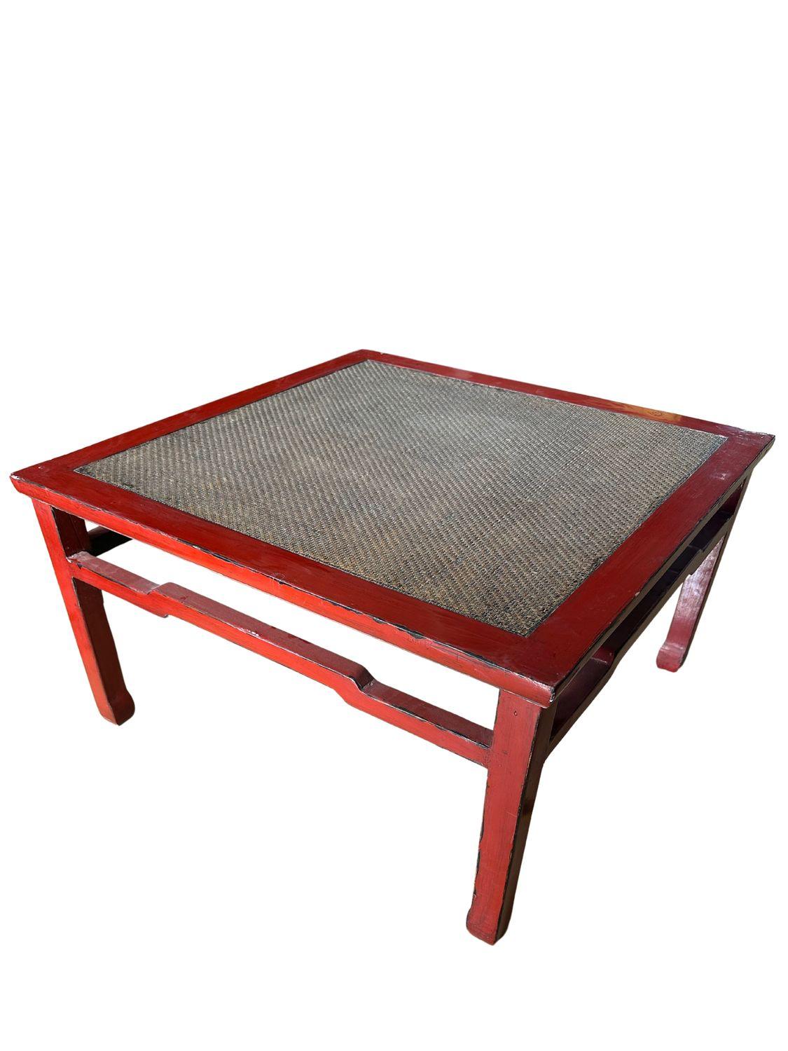 Elevate your living space with our stunning Red Elm Wood Coffee Table, featuring an intricately designed rattan center. The rich, warm tones of the red elm wood provide a striking contrast to the natural, woven rattan, creating a visually appealing