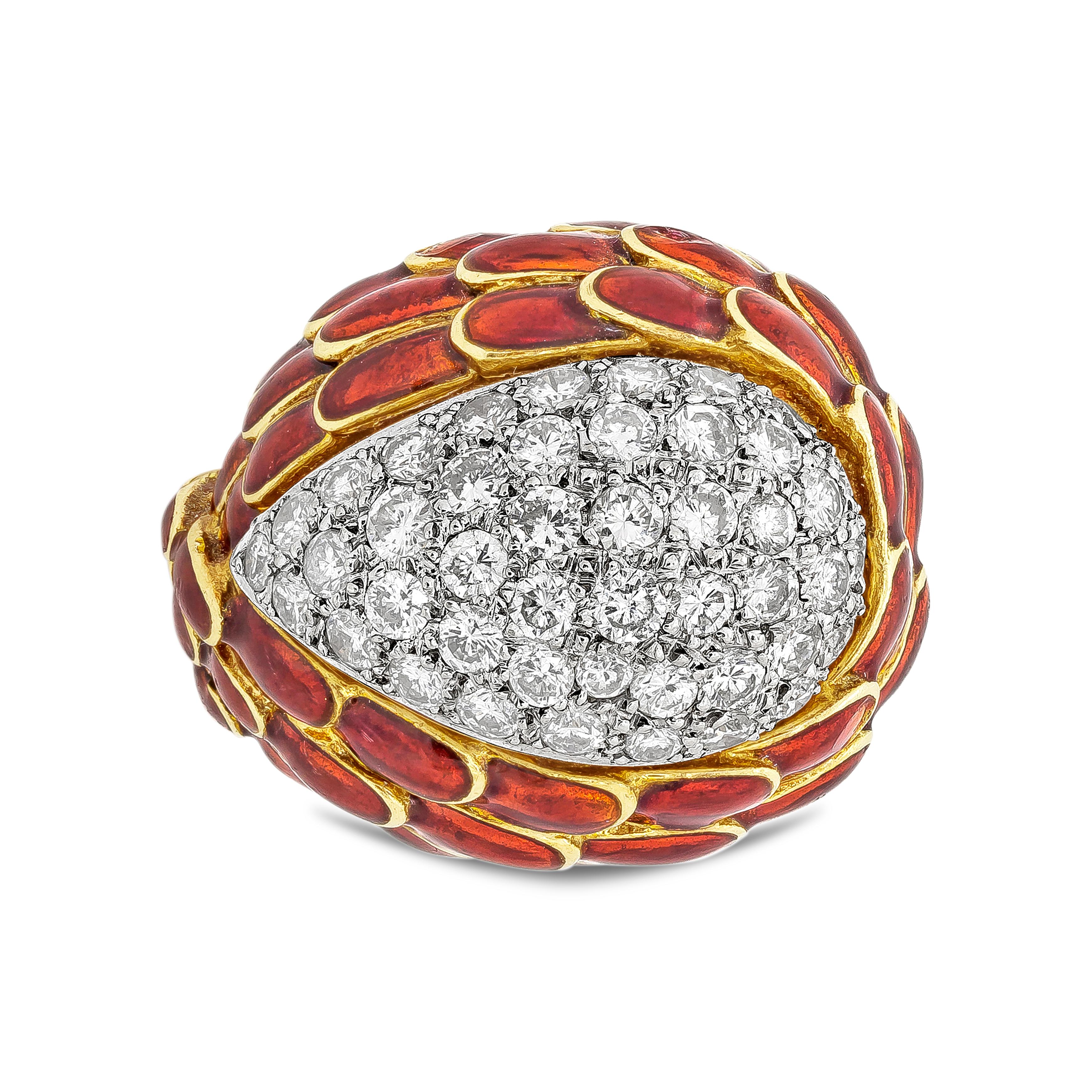 A unique and stylish cocktail ring showcasing a micro-pave of round diamonds weighing 1.40 carats total, set in a domed pear shape. Enclosing the diamonds is a bird wing design made in red enamel. Made in Italy, 18k yellow gold.