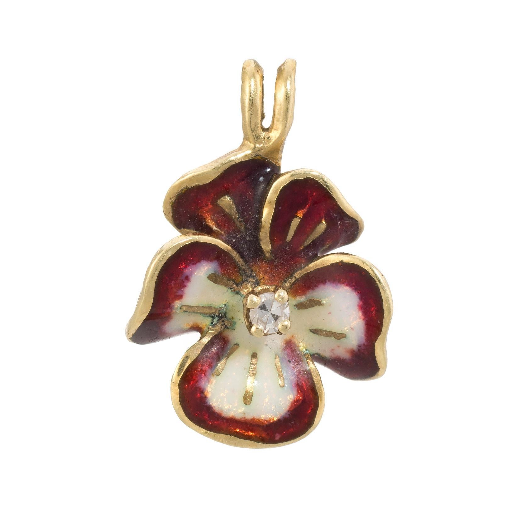 Finely detailed pansy pendant, crafted in 14 karat yellow gold. 

Single cut diamond is estimated 0.01 carats (estimated at I-J color and VS2 clarity). The red and white enamel is in excellent condition and free of cracks or chips.

The pendant is