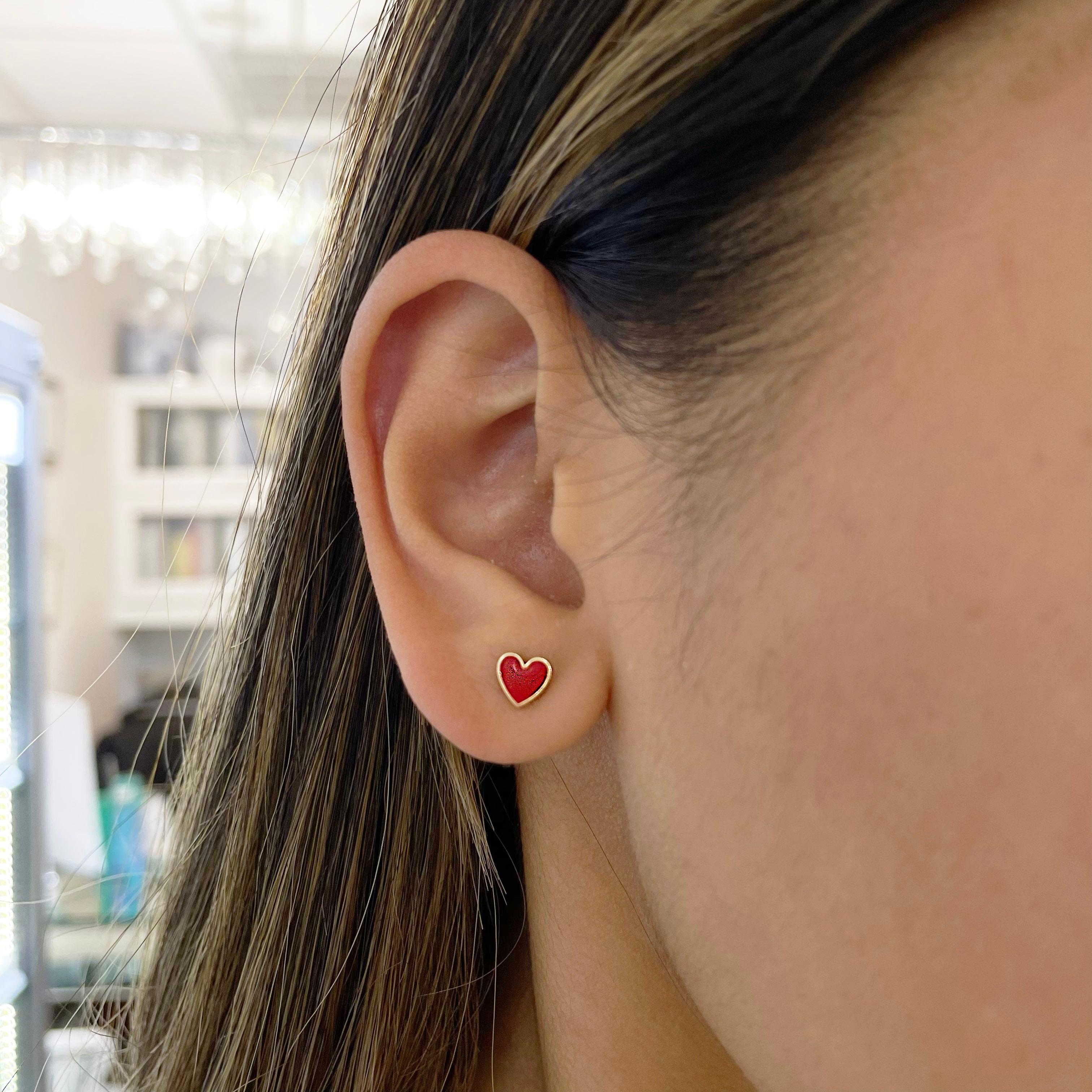 Red represents love, passion, a fiery spirit, courage, and so much more! These petite heart studs with red enamel are perfect on their own or stacked on your ear with your other favorite earrings. Enamel is a beautiful and distinctive look in fine