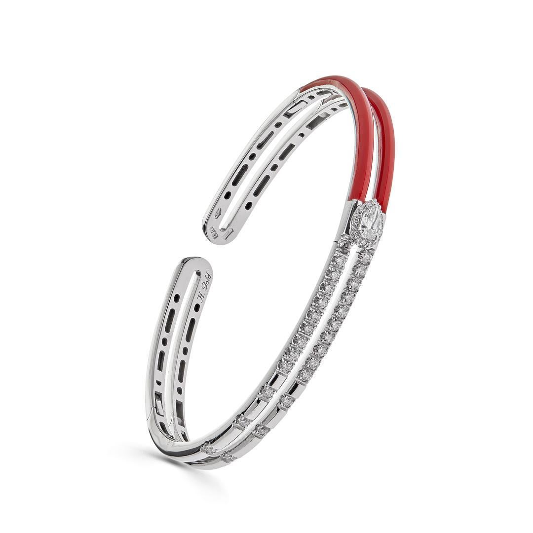 Introducing the exquisite 18k White Gold Red Enamel Diamond Double Bangle Bracelet, a stunning piece that harmoniously blends sophistication with a pop of vibrant color.

Crafted to perfection, this bracelet features two bangles intricately crafted