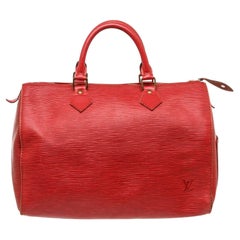 Red Epi leather Louis Vuitton Speedy 30 with brass hardware, dual rolled handles