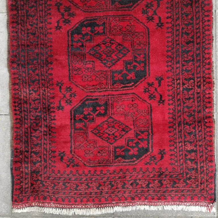 Ersari stairway or hallway runner red tribal rug Afghan rug.

The Turkmen or Turkoman people are settling in villages in Afghanistan and Turkmenistan near the Persian border. Their origin is tribal nomadic, but most members of the tribes have