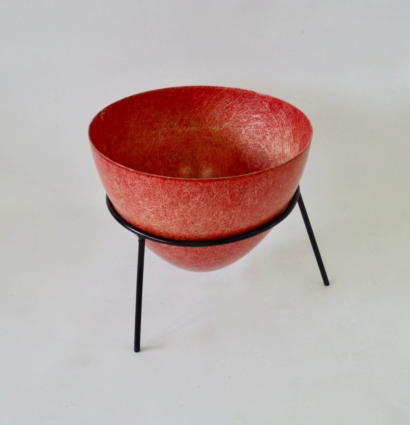 Nicely grained Greta Grossman style red fiberglass planter pot in wrought iron stand. Marked Kimball Mfg. Corp, San Francisco.