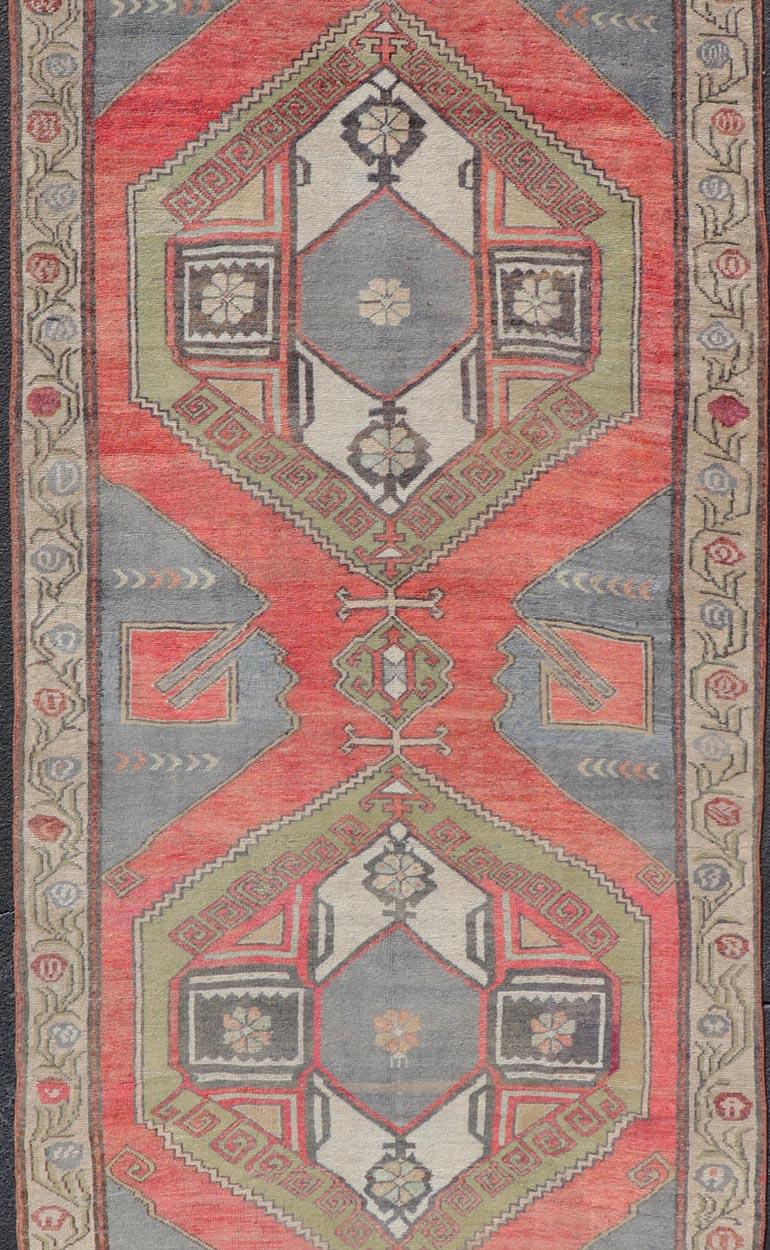 Hand-Knotted Red Field Vintage Turkish Oushak Gallery Runner with A Geometric Design For Sale
