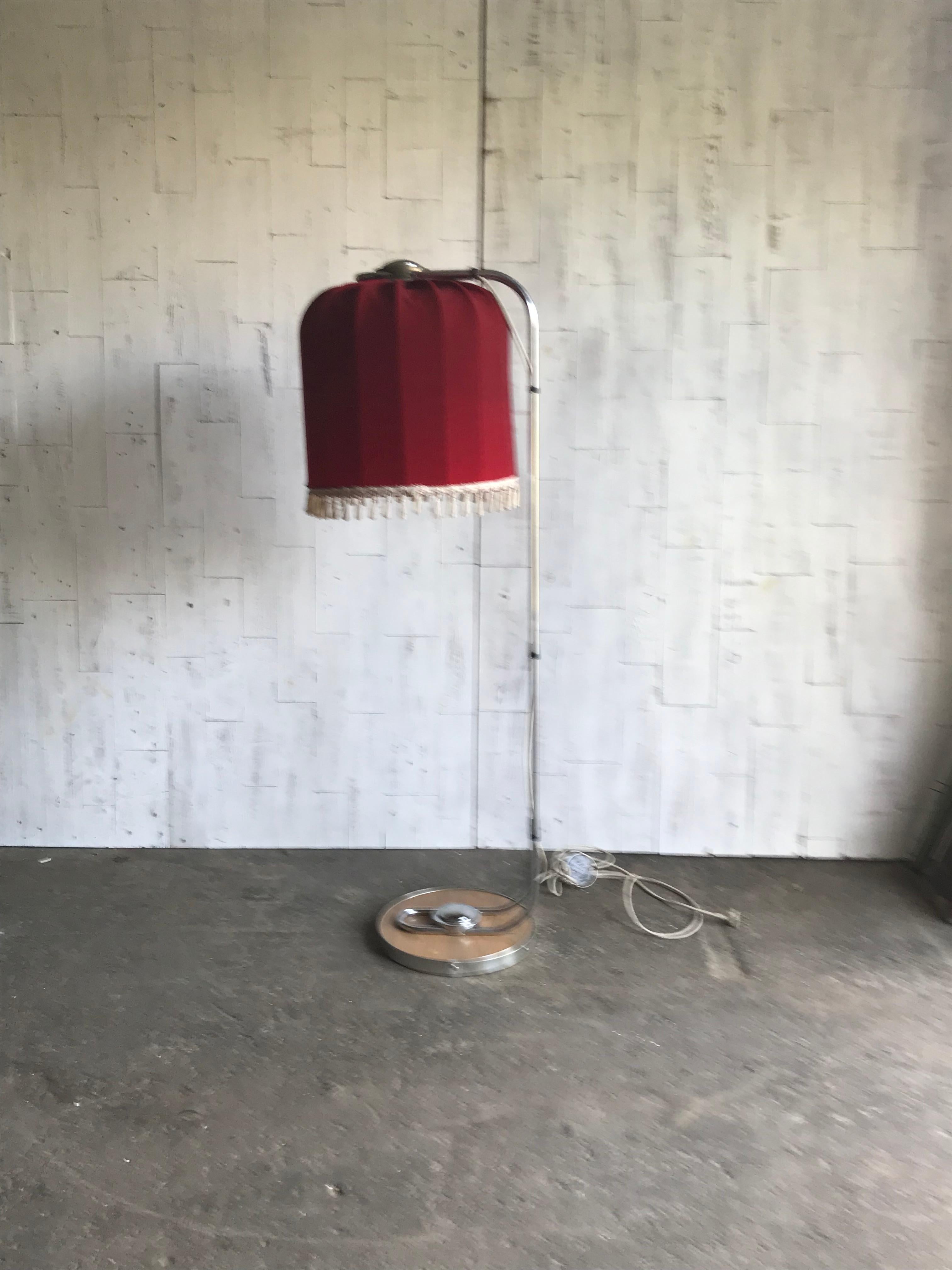Red floor lamp with beautiful shaped shade.     
   