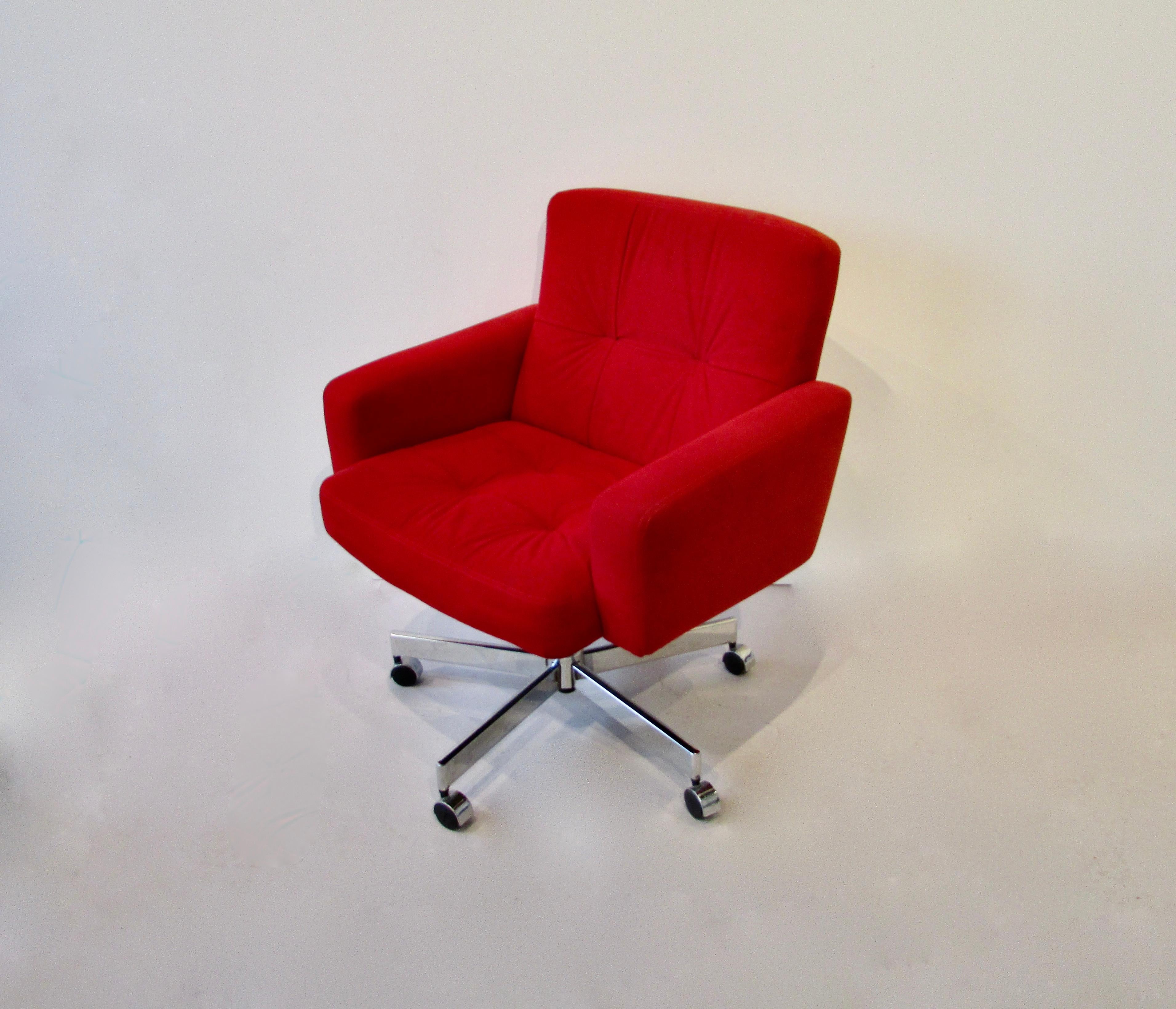 I believe this is red ultra suede fabric on rolling chrome base. Very nice condition. Chair swivels and tilts. Manufactured by Fortress furniture of California. There were four available. Two remain .