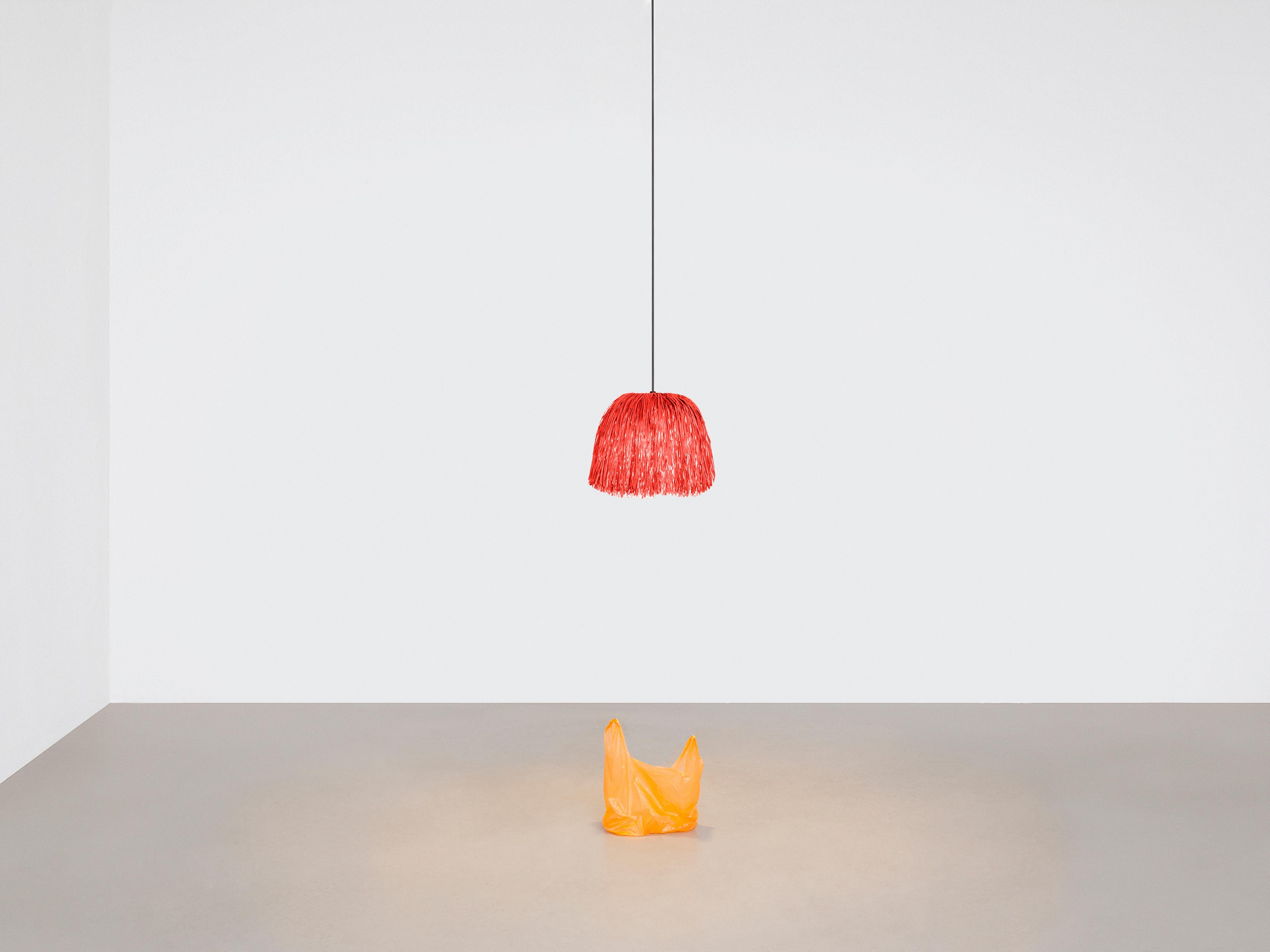 Red Fran XS Lamp by Llot Llov
Handcrafted light object
Dimensions: Ø 24 cm x H 30 cm
Materials: raffia fringes
Also available in green, red, black, beige 

With their bulky silhouette and rustling fringes, the FRAN lights are reminiscent of a