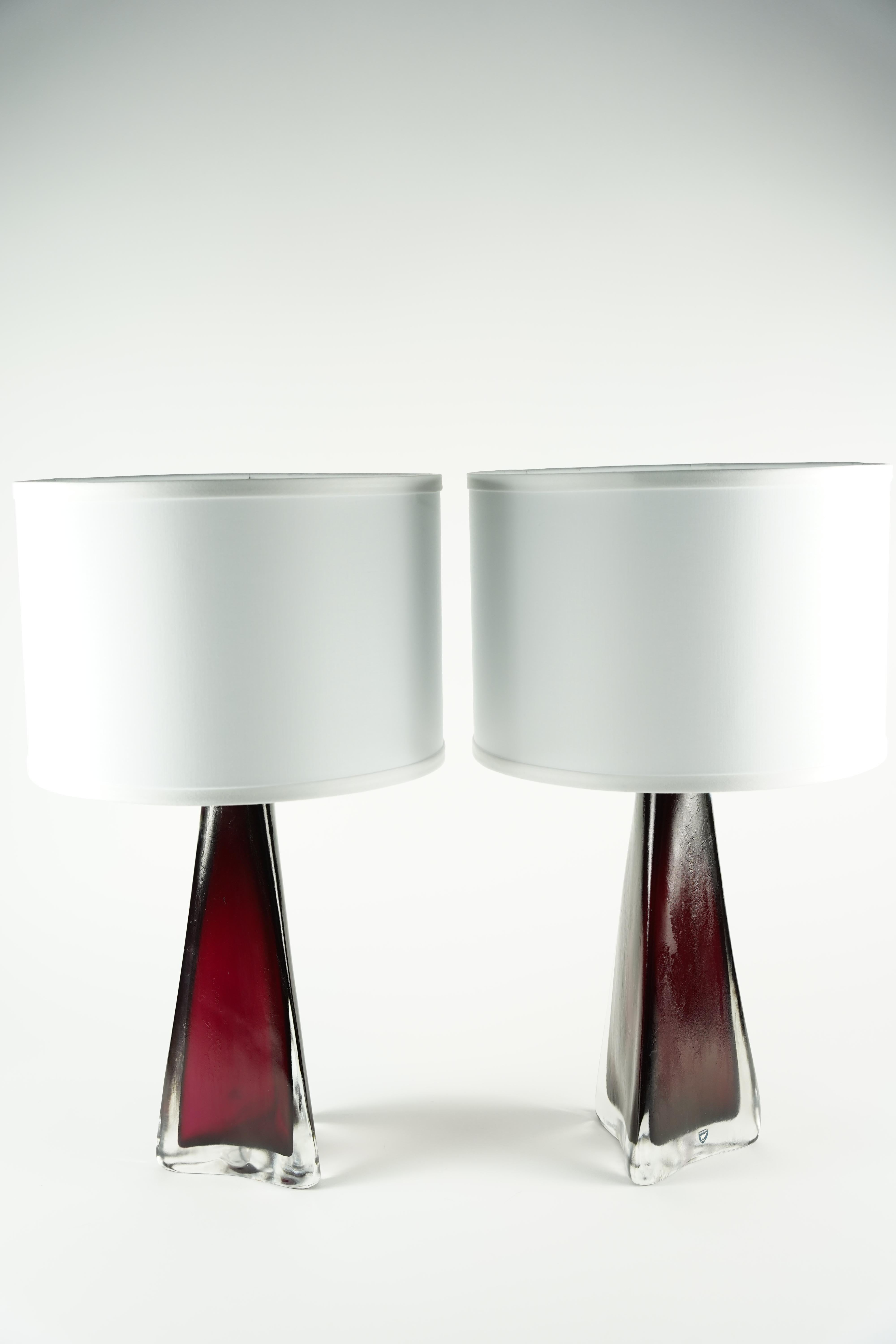  Pair of red triangular glass lamps with brass fittings designed By Carl Fagerlund for Orrefors 1950.
Signed on the bottom.

Rewired for the US.

Shades not included.