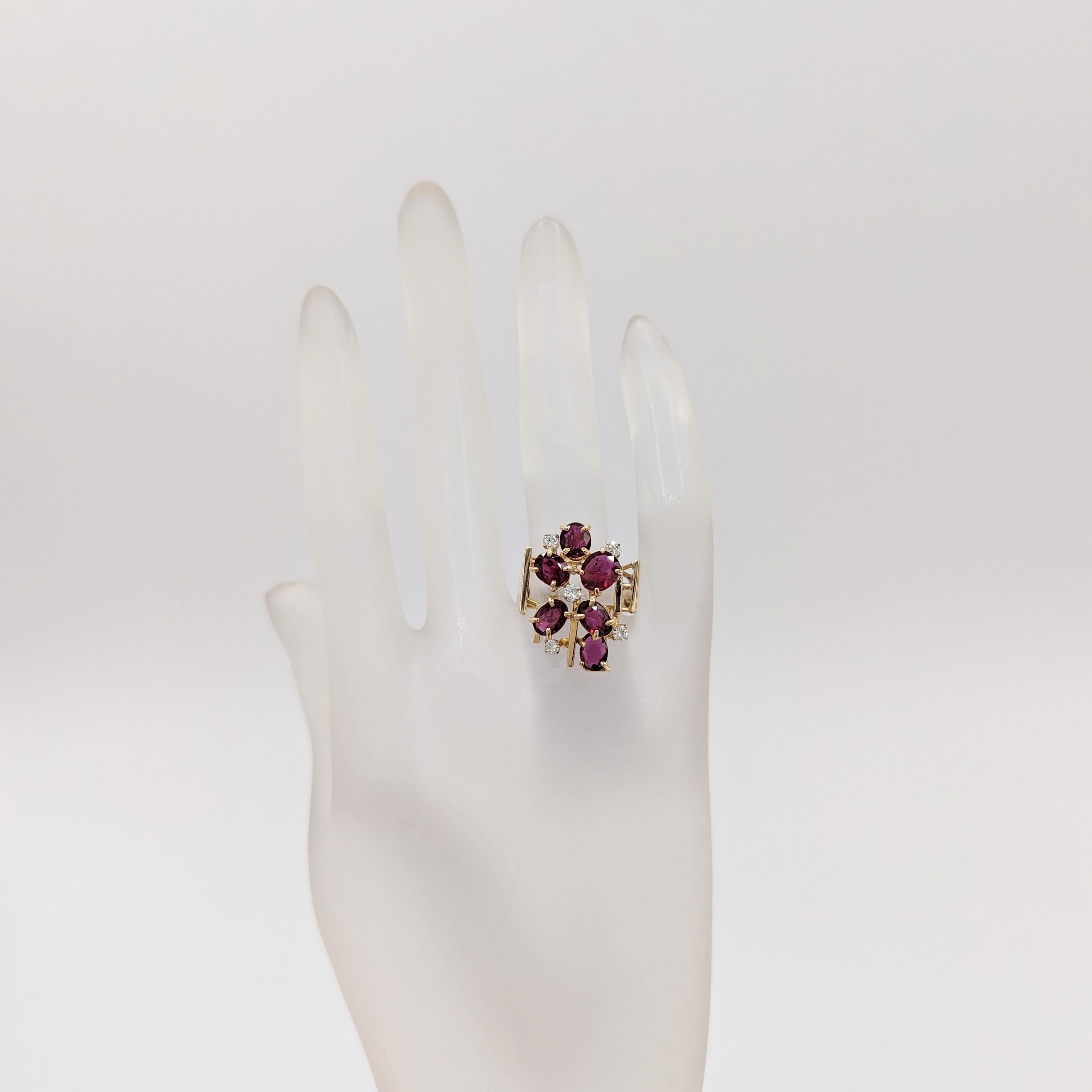 Oval Cut Red Garnet and White Diamond Cluster Ring in 14K Yellow Gold For Sale