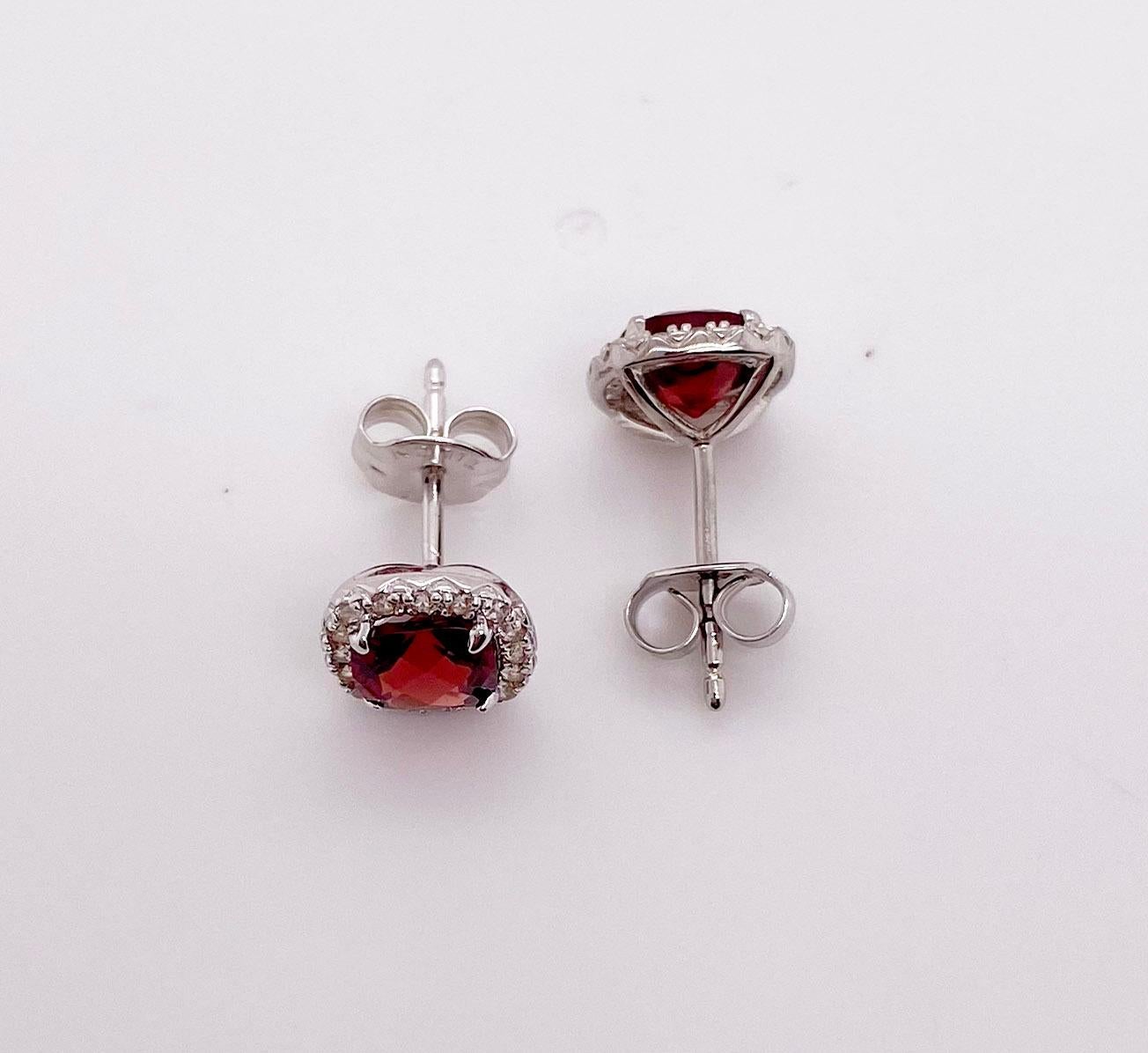 The details for these gorgeous earrings are listed below:
Metal Quality: Sterling Silver 
Earring Type: Stud
Gemstone 1: Garnet 
Gemstone Weight 1: .50 ct 
Gemstone Color 1: Red 
Gemstone 2: White Sapphire 
Gemstone Weight 2: .15
Gemstone Number 2: