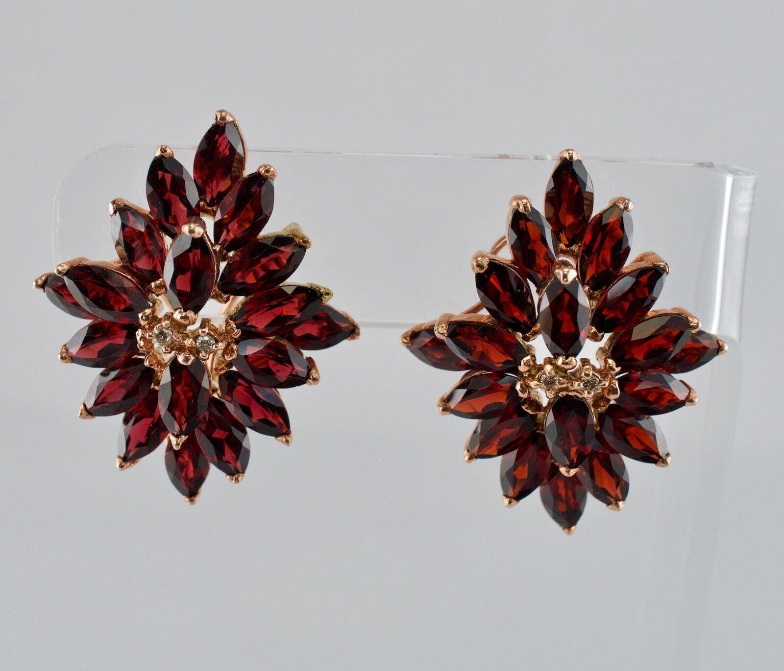 This beautiful pair of earrings vintage is finely crafted in solid 14K Rose Gold and set with cleanest genuine Earth mined Garnets and Diamonds. Each earring holds nineteen marquise cut Garnets measuring 7mm x 3.5mm for the grand total 15.96 carats