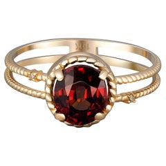 Red garnet gold ring.